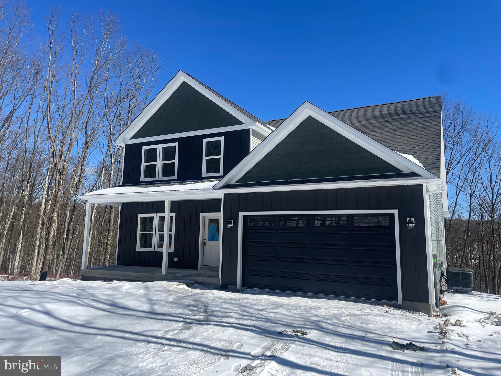 a front view of a house with a garage