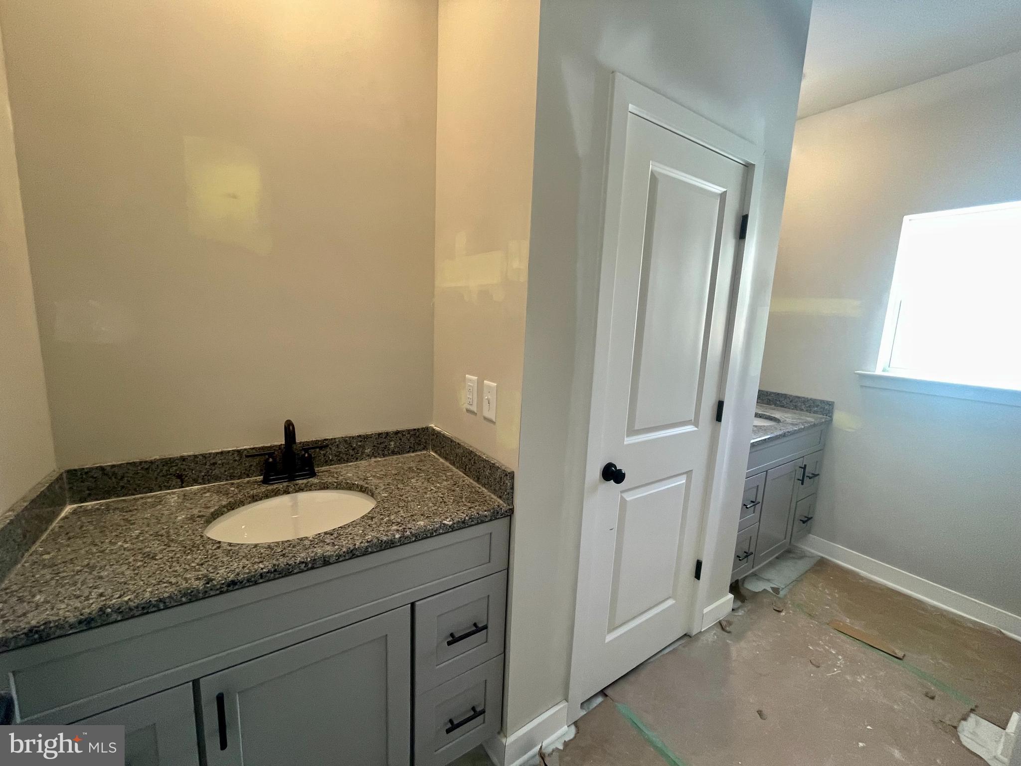 180 Stone Ridge Albrightsville, PA 18210 - Photo 11 of 23 a bathroom with a granite countertop sink and white cabinets