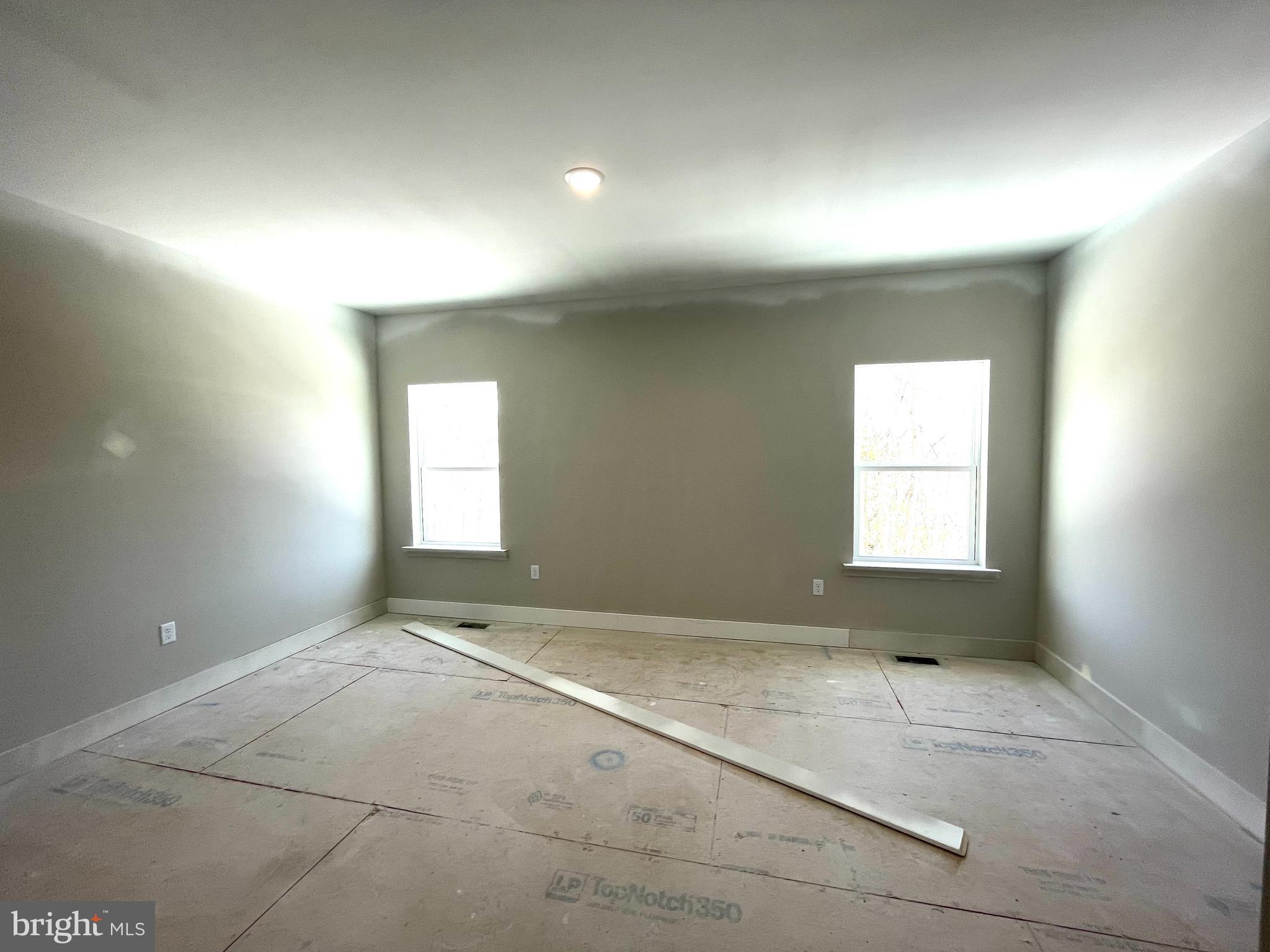 180 Stone Ridge Albrightsville, PA 18210 - Photo 10 of 23 an empty room with a empty space and windows