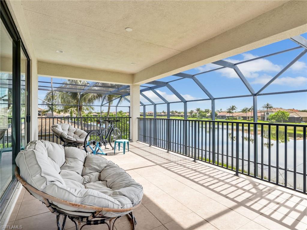 2756 Crystal Way Naples, FL 34119 - Photo 35 of 50 a balcony with furniture and a potted plant