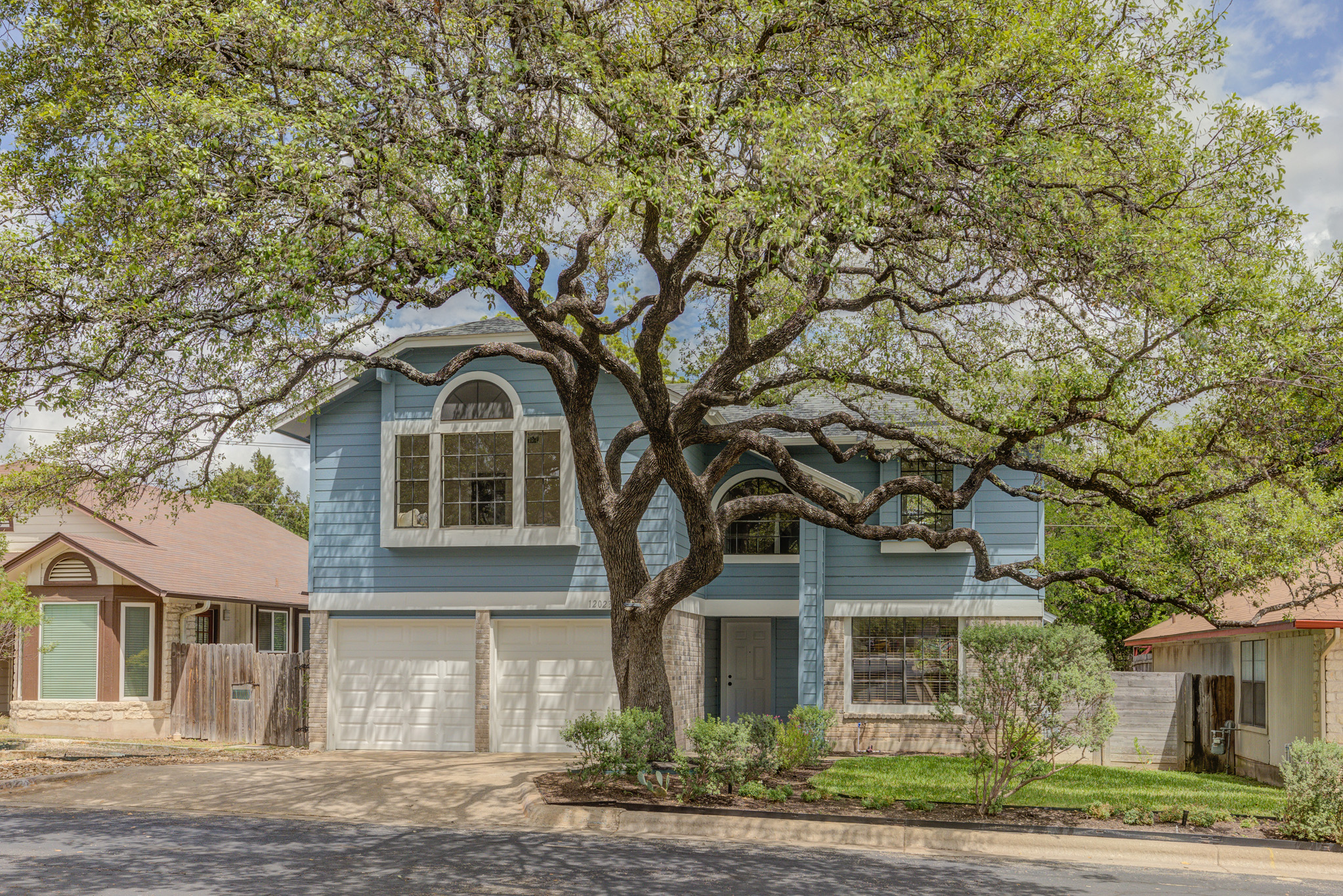 12023 Shady Springs Road Austin, TX 78758 - Photo 1 of 1 beautiful landscaped front yard and huge tree to shade yard