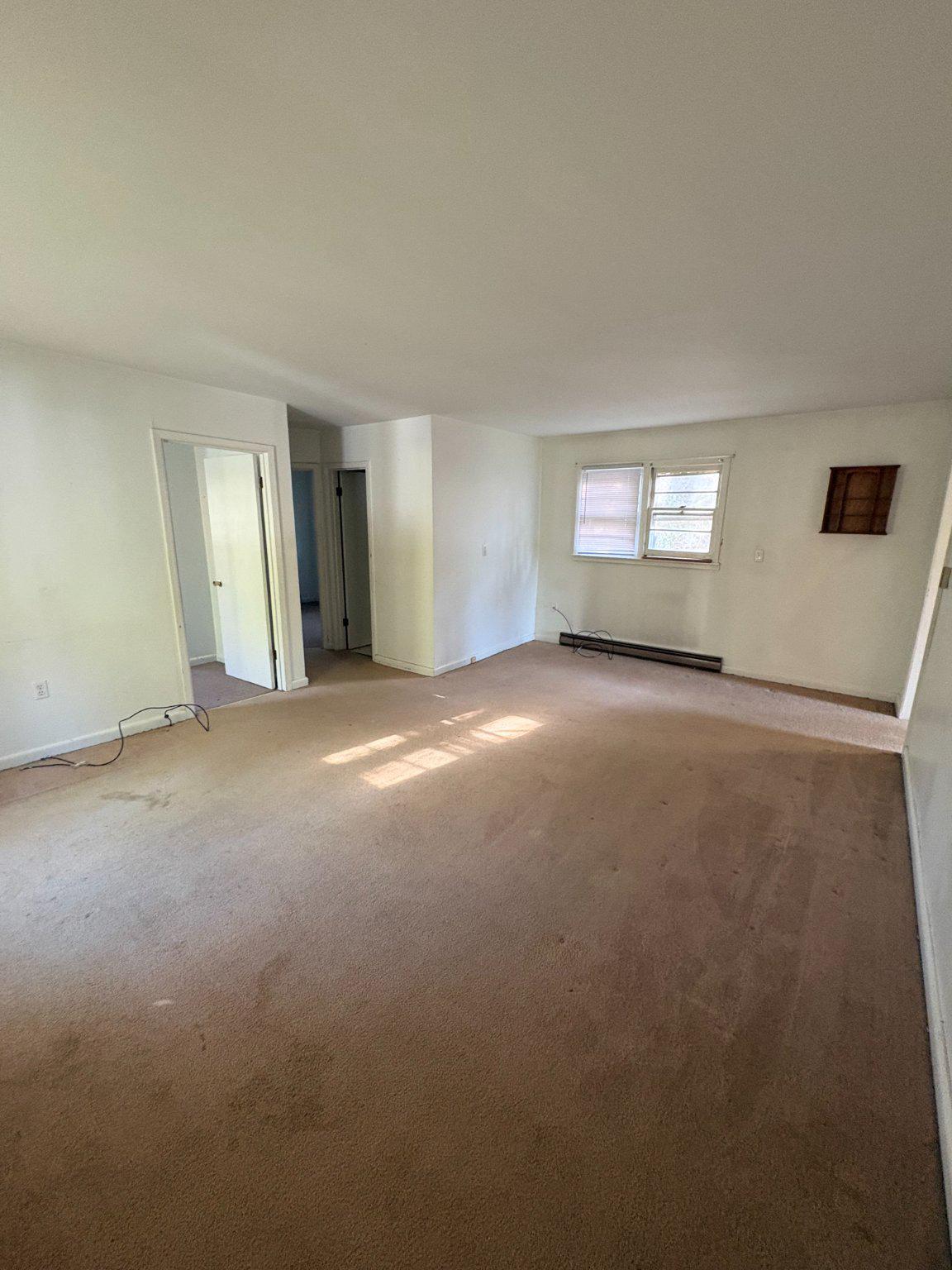 119 Radio Station Road Berkeley Springs, WV 25411 - Photo 8 of 14 Spacious, sunlit living area awaits.