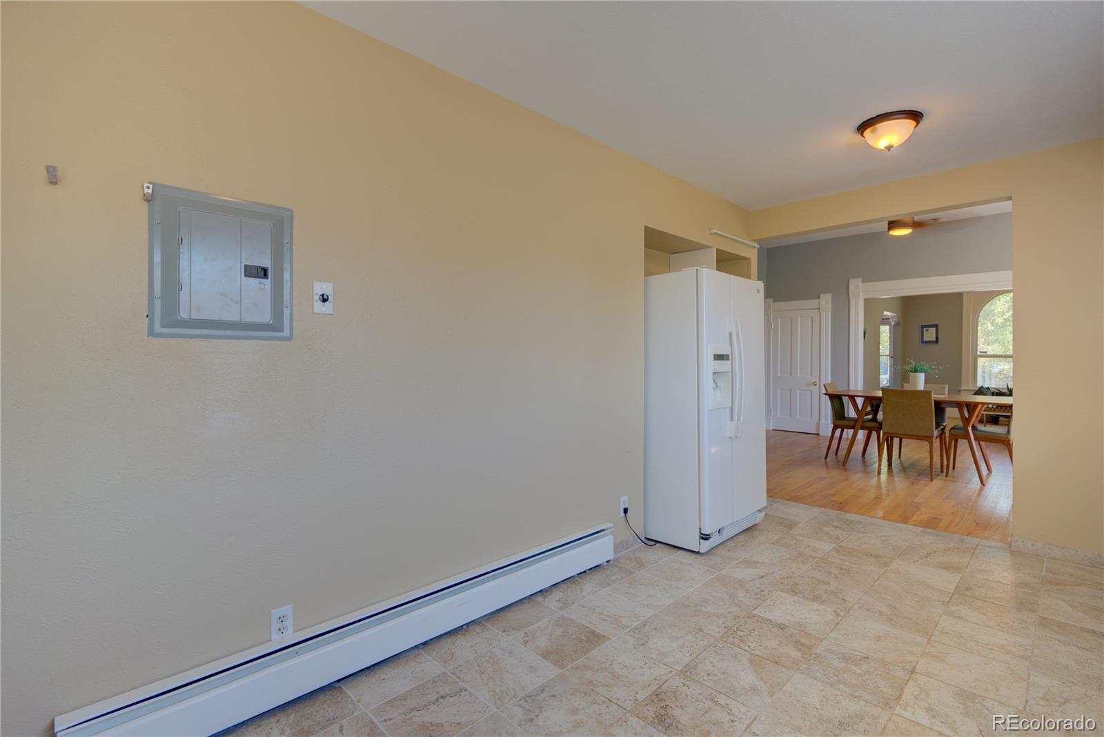 2537 Ames Street Edgewater, CO 80214 - Photo 16 of 38 an empty room with furniture and a painting