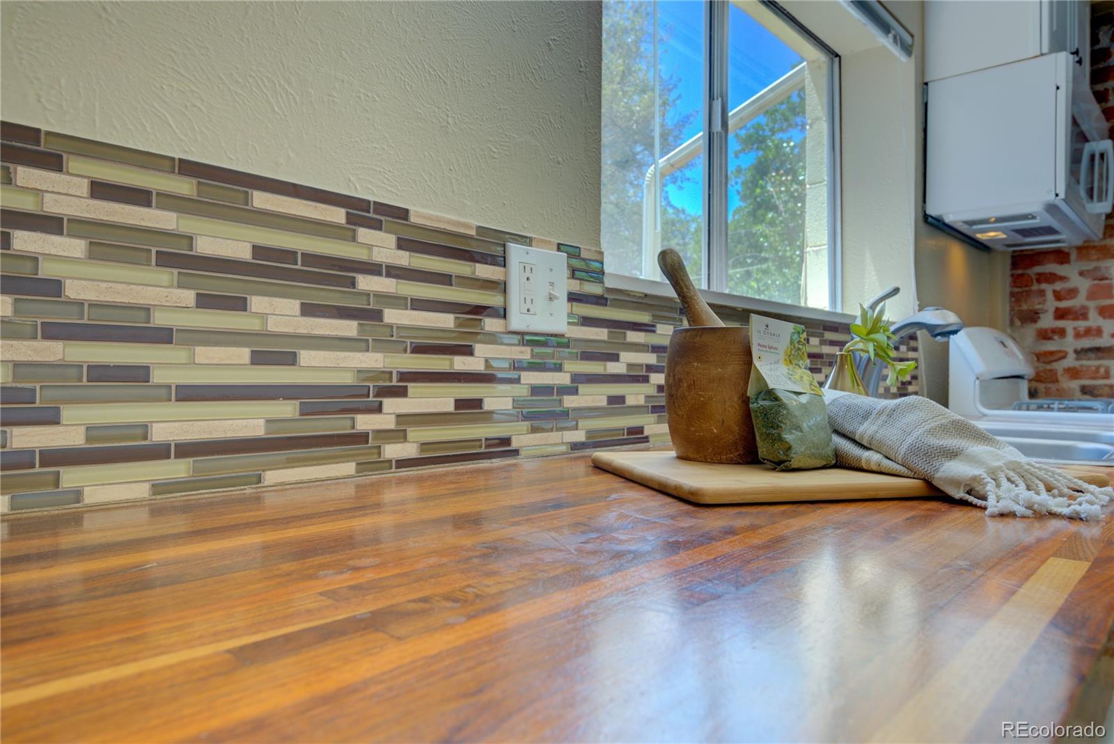 2537 Ames Street Edgewater, CO 80214 - Photo 18 of 38 a view of water heater room with wooden floor