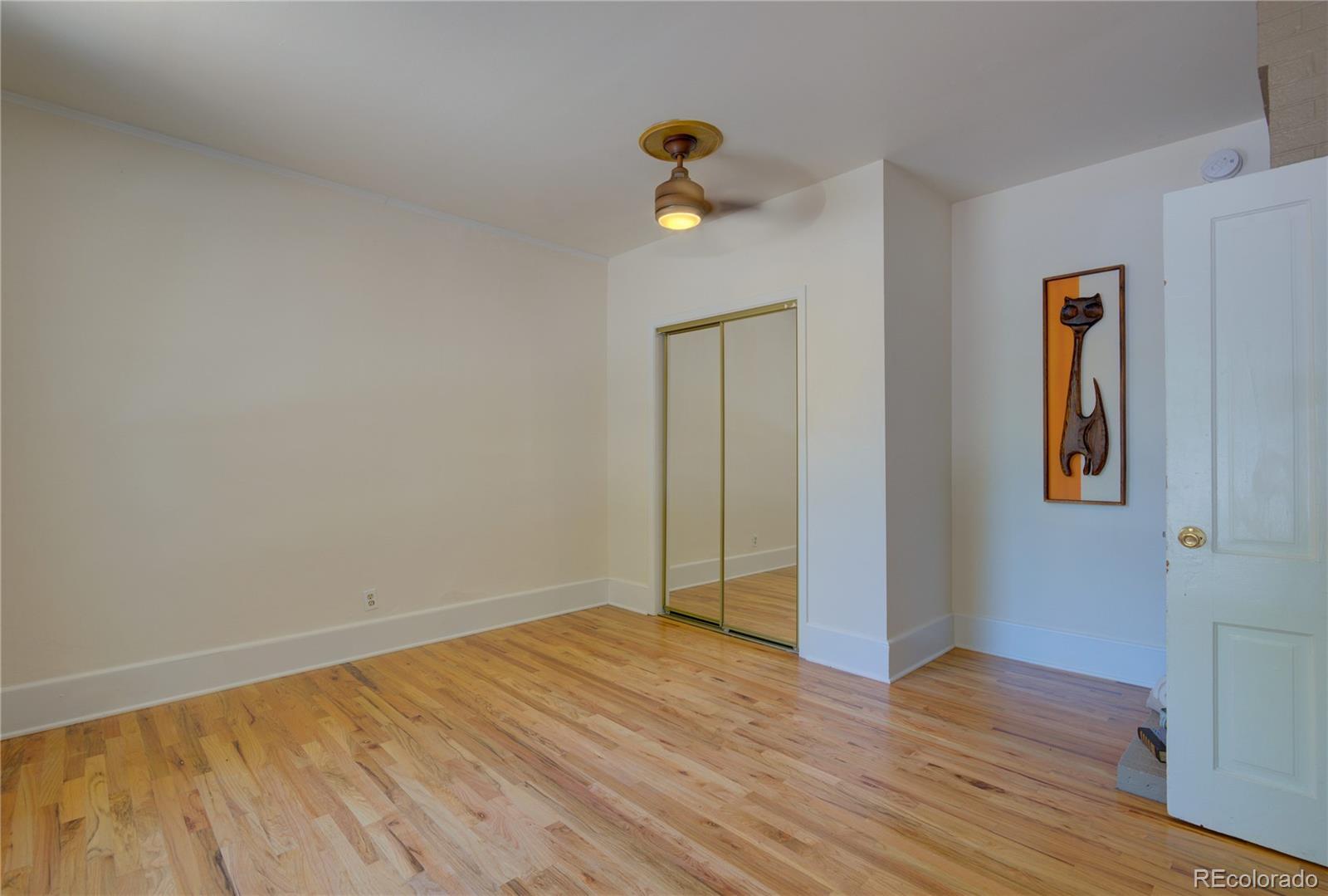 2537 Ames Street Edgewater, CO 80214 - Photo 26 of 38 a view of empty room with wooden floor