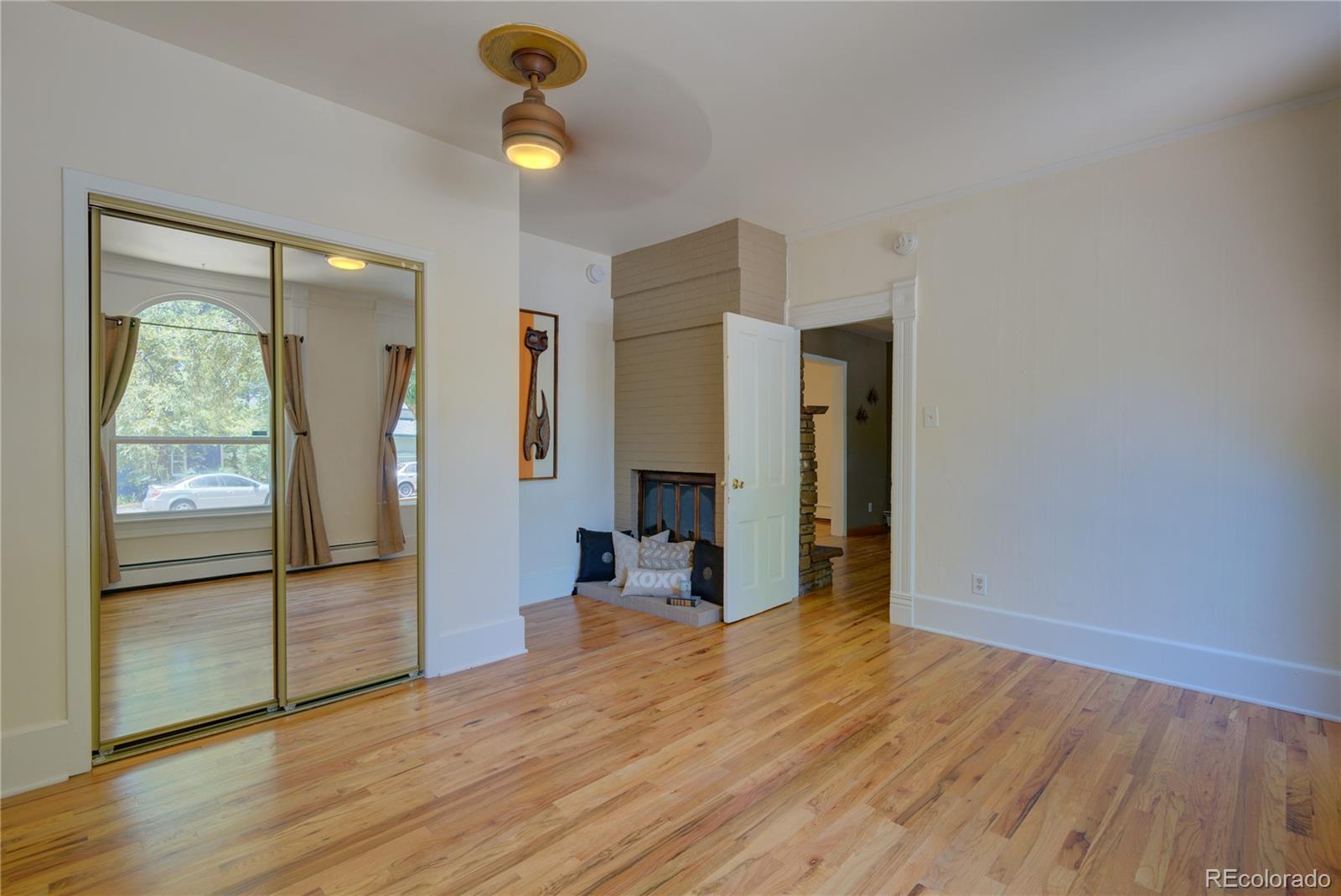 2537 Ames Street Edgewater, CO 80214 - Photo 27 of 38 a view of a living room with wooden floor