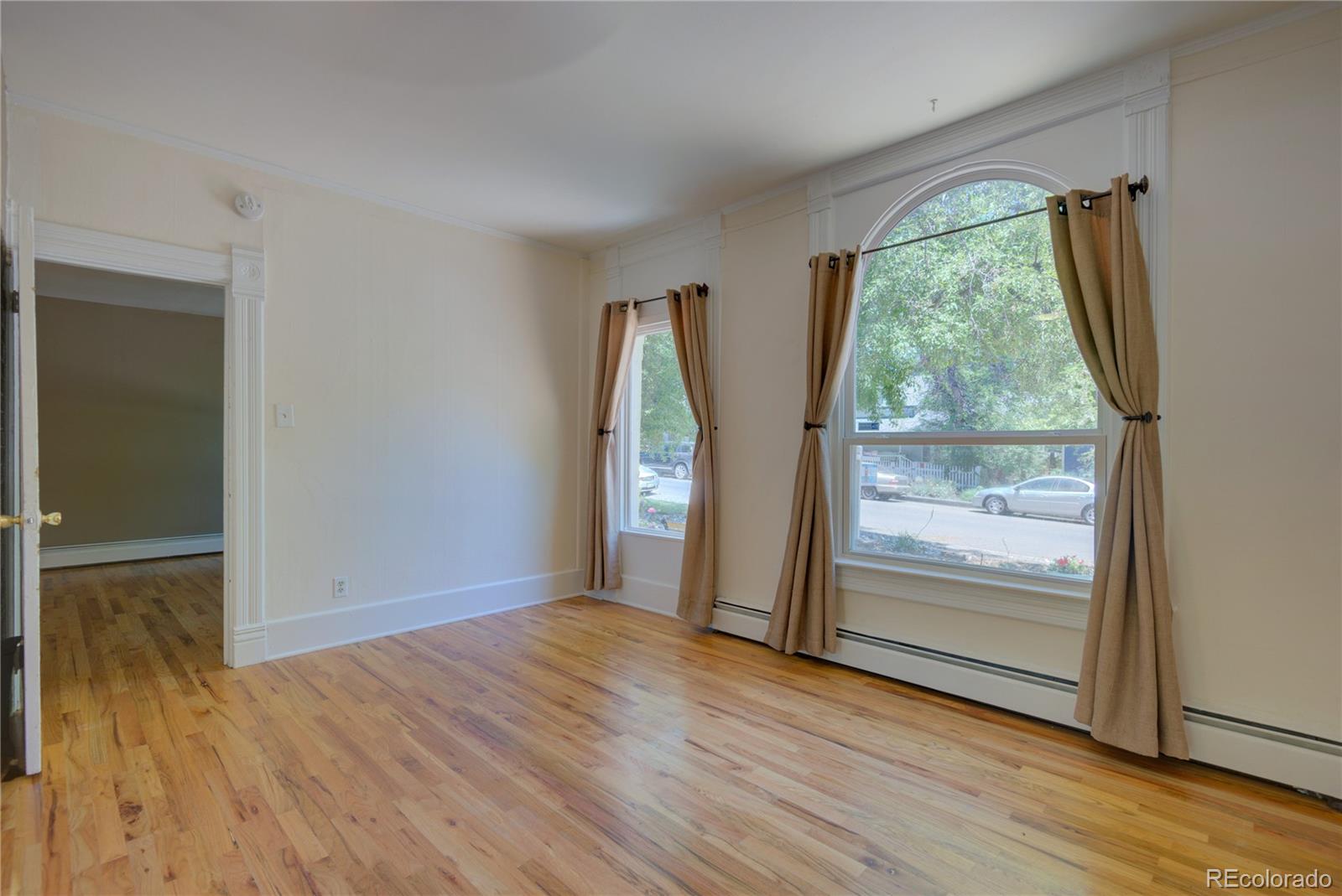 2537 Ames Street Edgewater, CO 80214 - Photo 28 of 38 wooden floor in an empty room with a window