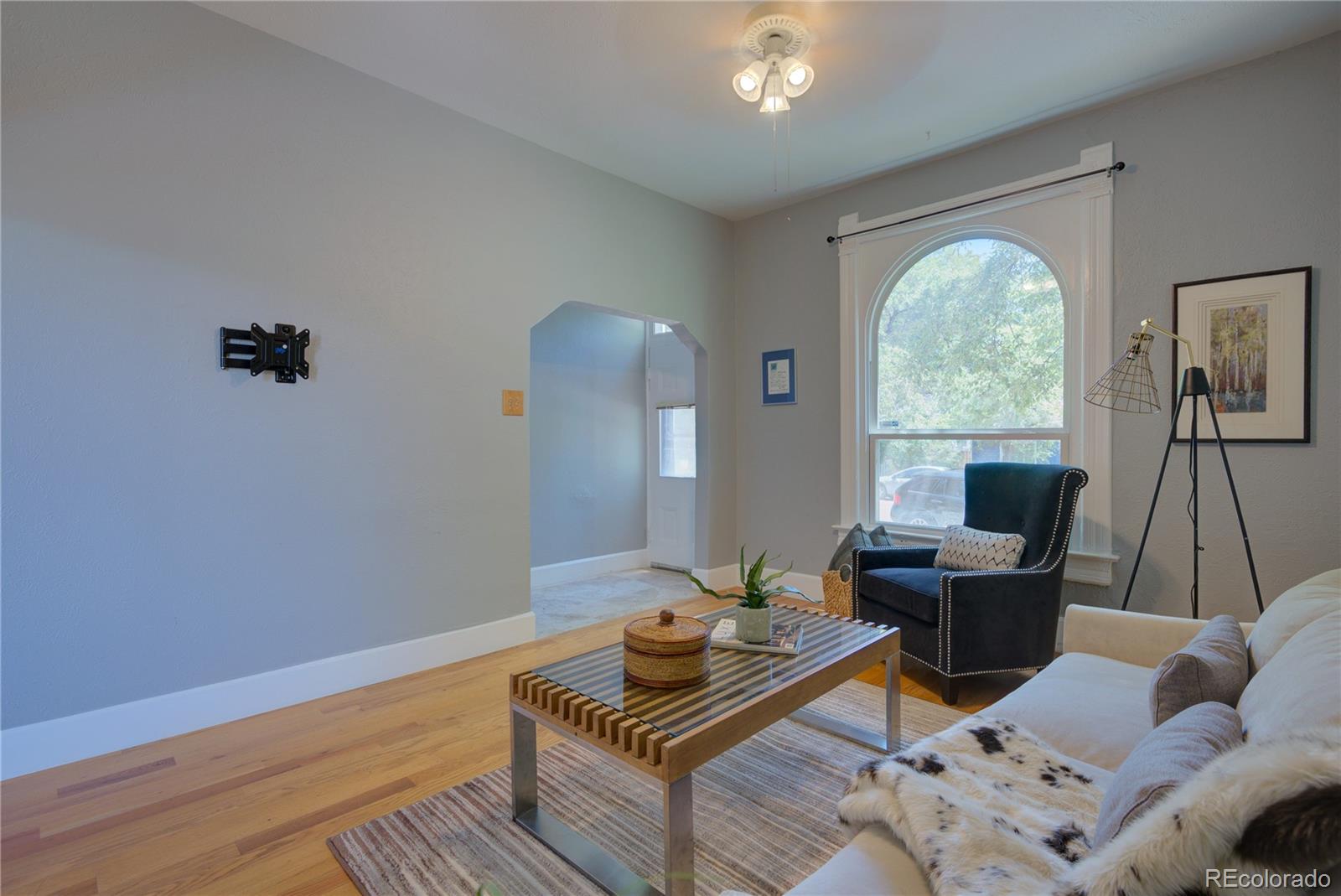 2537 Ames Street Edgewater, CO 80214 - Photo 4 of 38 a living room with furniture and a window
