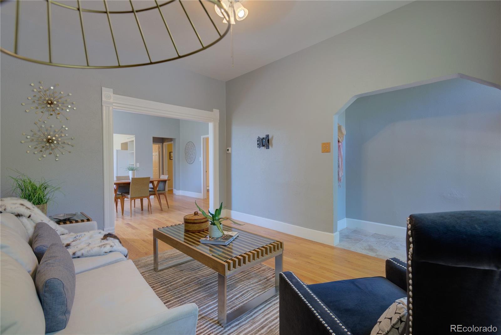 2537 Ames Street Edgewater, CO 80214 - Photo 5 of 38 a living room with furniture and wooden floor