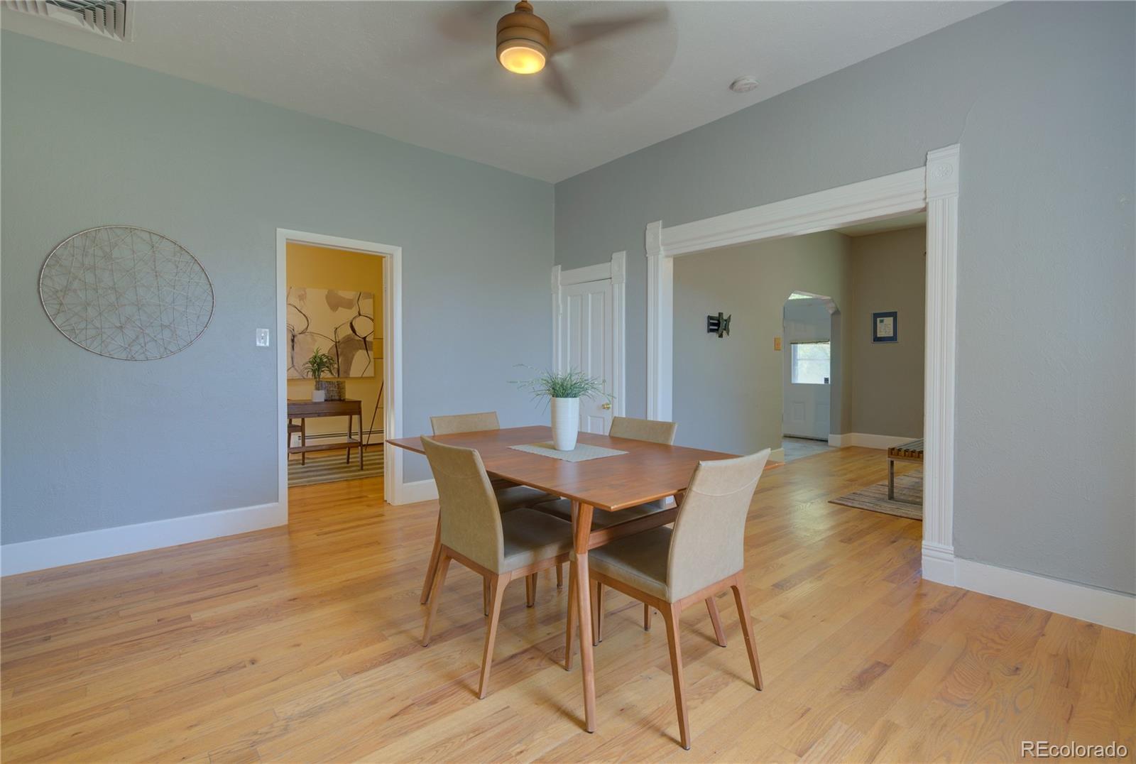 2537 Ames Street Edgewater, CO 80214 - Photo 7 of 38 a view of a dining room with furniture and wooden floor
