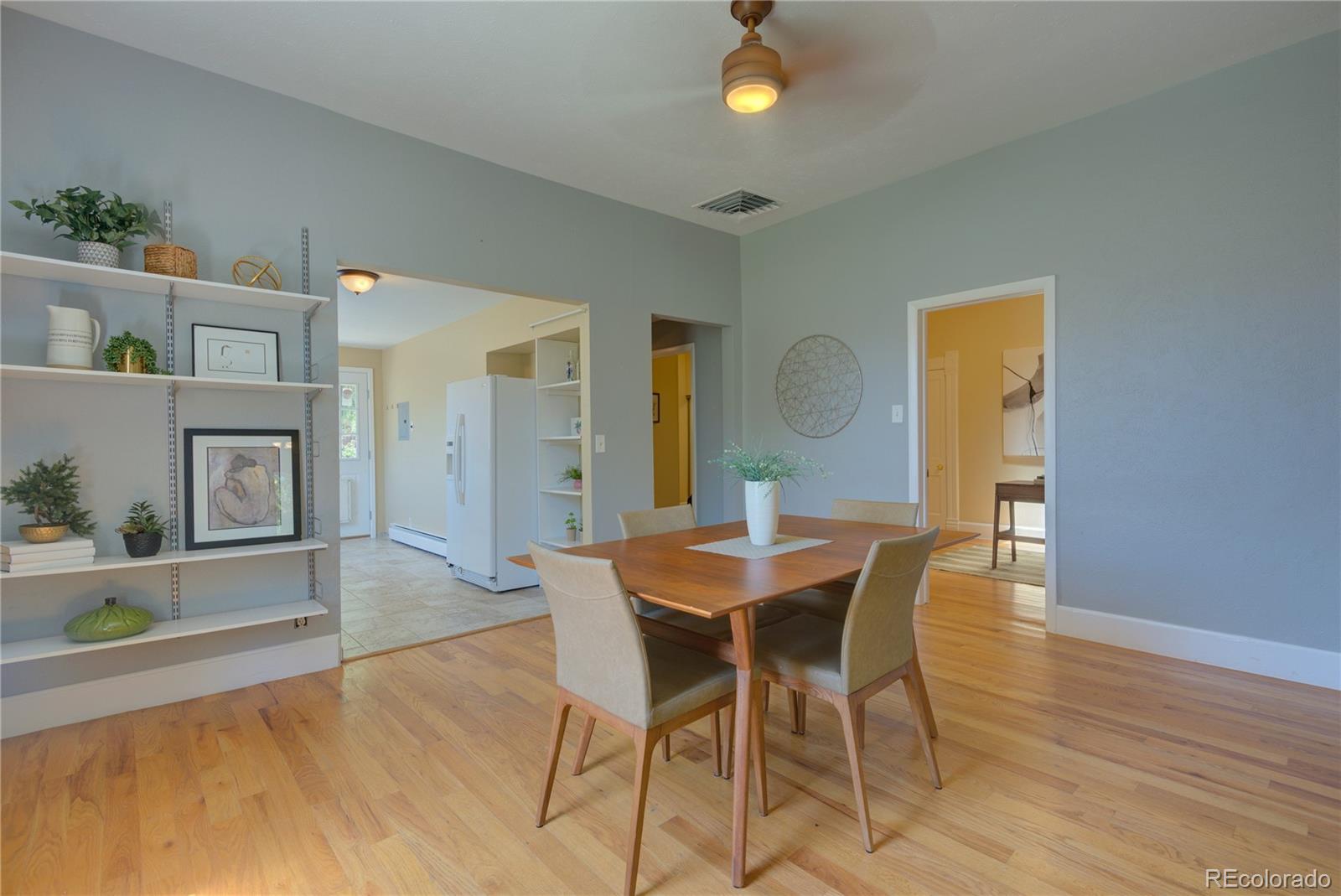 2537 Ames Street Edgewater, CO 80214 - Photo 8 of 38 a dining room with furniture and window