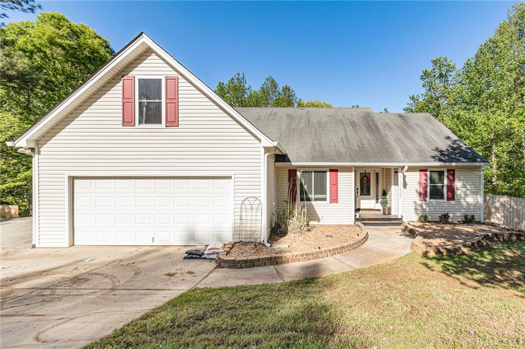 1819 River Run Road Monroe, GA 30656 - Photo 1 of 1 a front view of a house with a yard outdoor seating and garage
