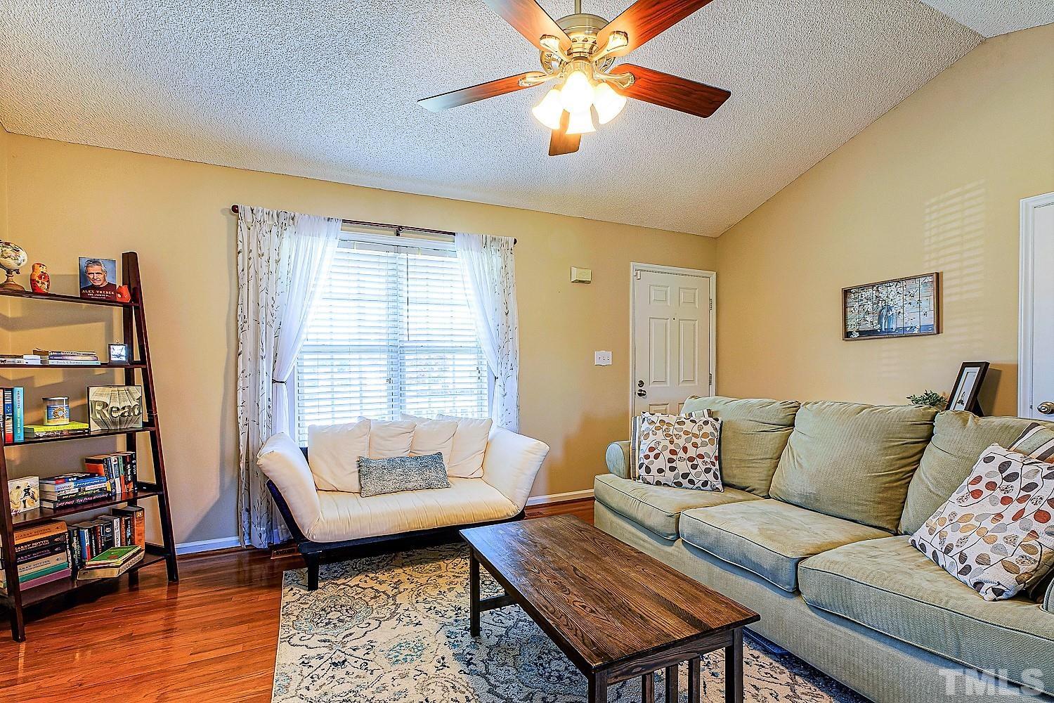 1001 Retriever Lane Raleigh, NC 27603 - Photo 15 of 50 a living room with furniture and a flat screen tv