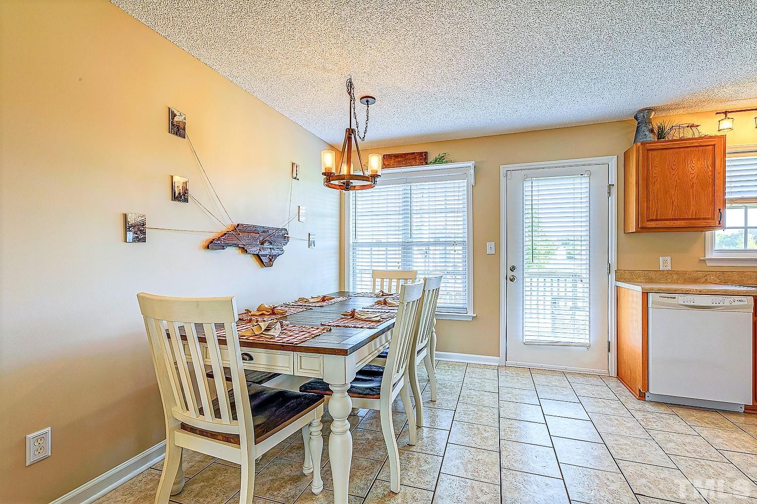 1001 Retriever Lane Raleigh, NC 27603 - Photo 17 of 50 a dining room with furniture and window
