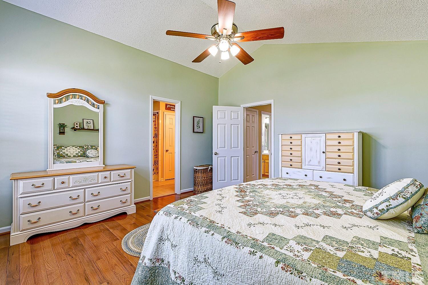 1001 Retriever Lane Raleigh, NC 27603 - Photo 28 of 50 a bedroom with a bed and a dresser