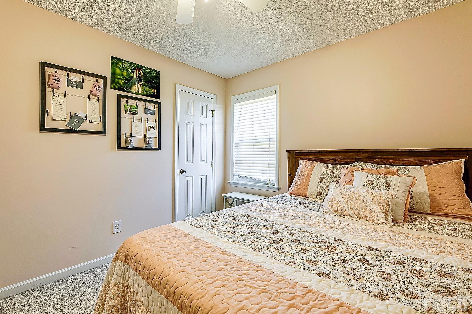 1001 Retriever Lane Raleigh, NC 27603 - Photo 34 of 50 a bedroom with a large bed and a window