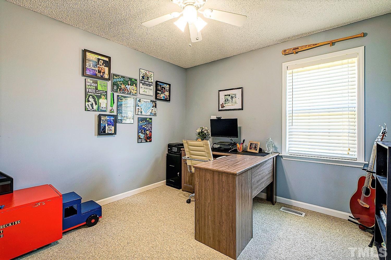 1001 Retriever Lane Raleigh, NC 27603 - Photo 36 of 50 a bedroom with a workspace