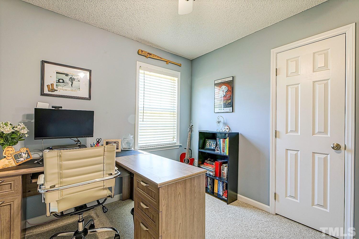 1001 Retriever Lane Raleigh, NC 27603 - Photo 37 of 50 a view of a livingroom with workspace and a window
