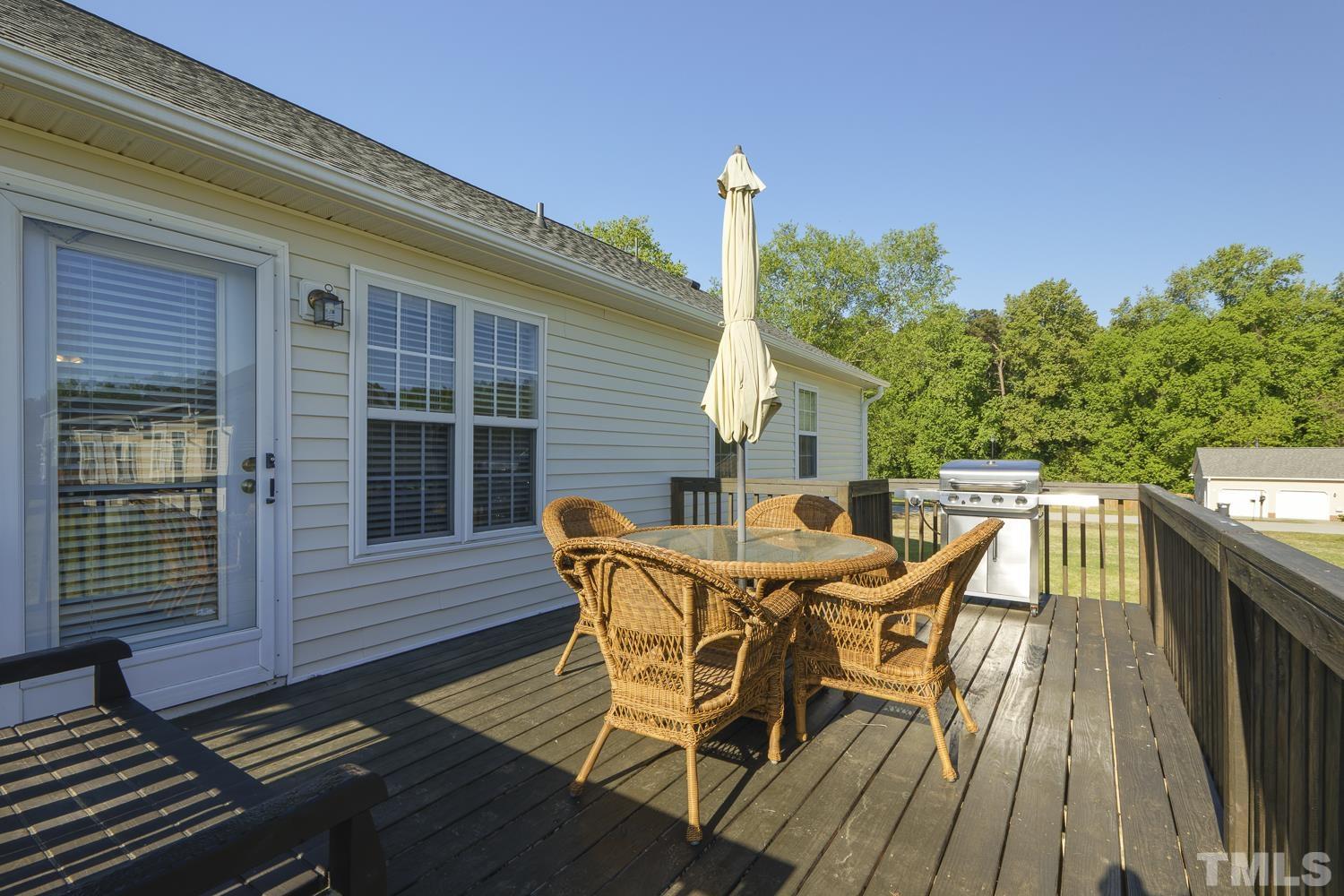 1001 Retriever Lane Raleigh, NC 27603 - Photo 38 of 50 a view of a patio with a table and chairs