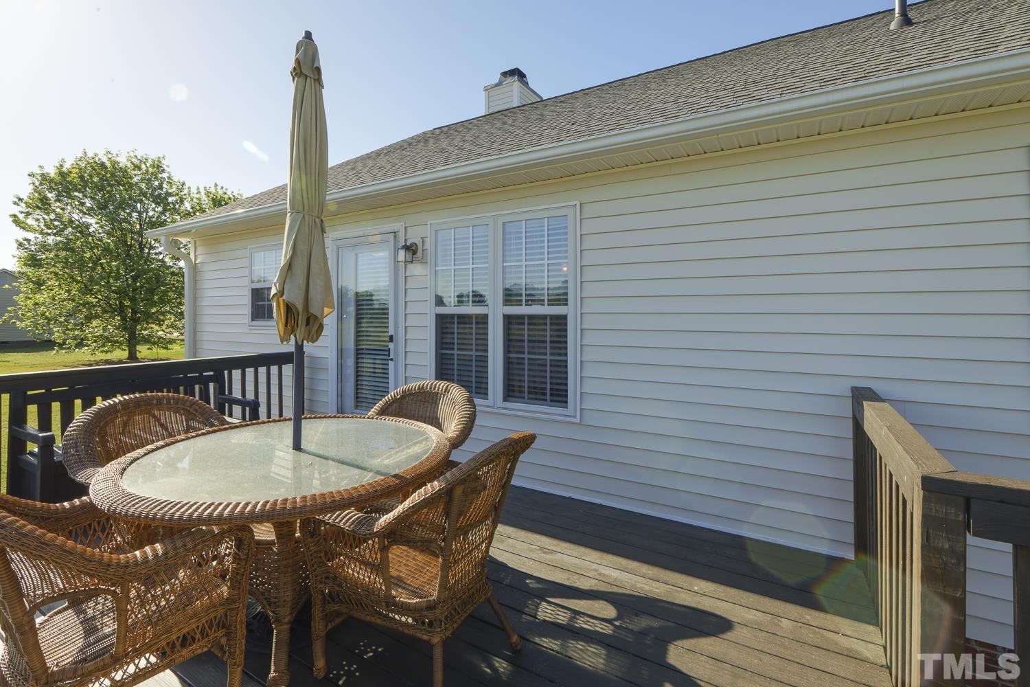 1001 Retriever Lane Raleigh, NC 27603 - Photo 41 of 50 a balcony with table and chairs