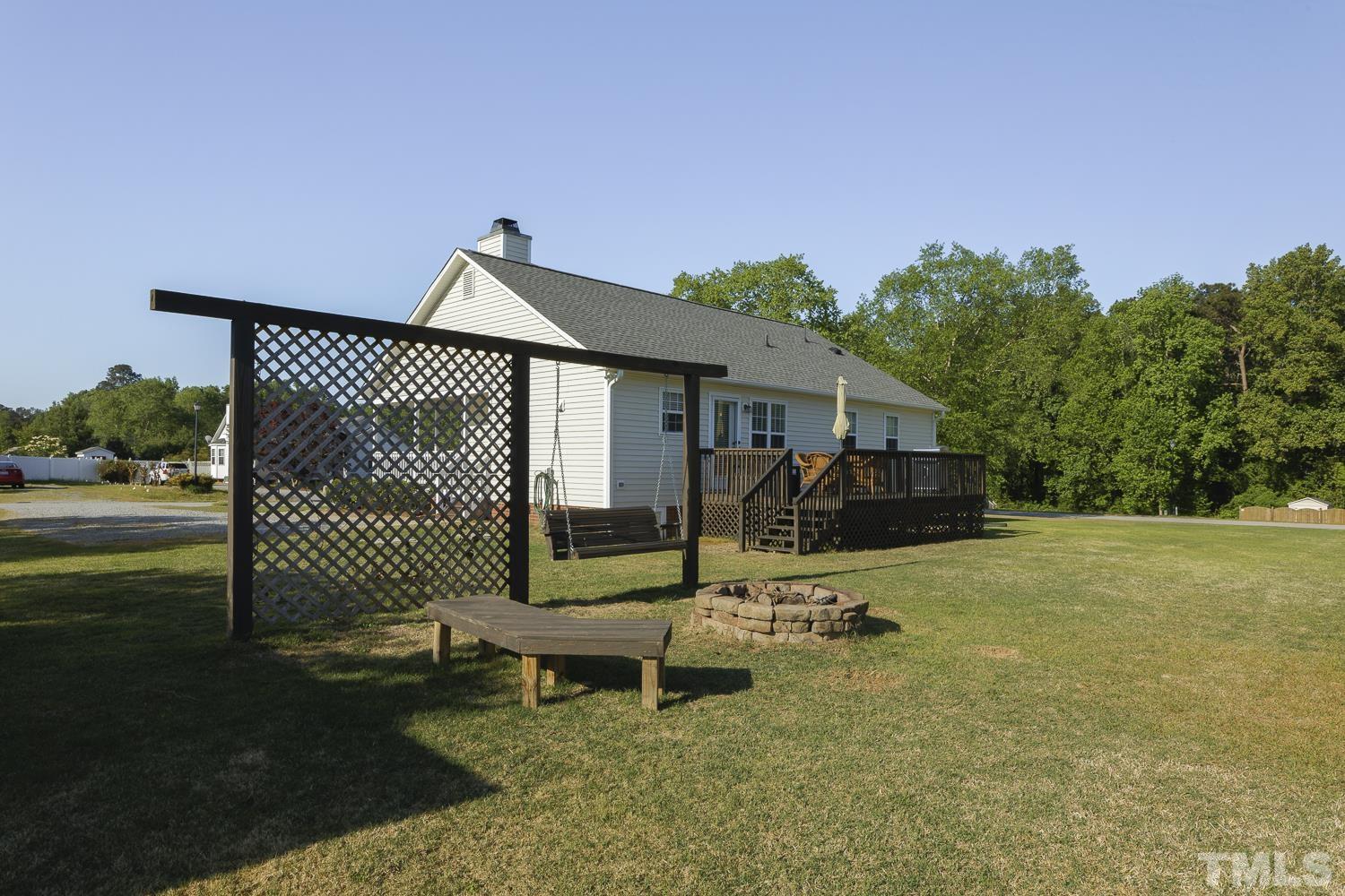 1001 Retriever Lane Raleigh, NC 27603 - Photo 45 of 50 a view of a backyard with sitting area and garden
