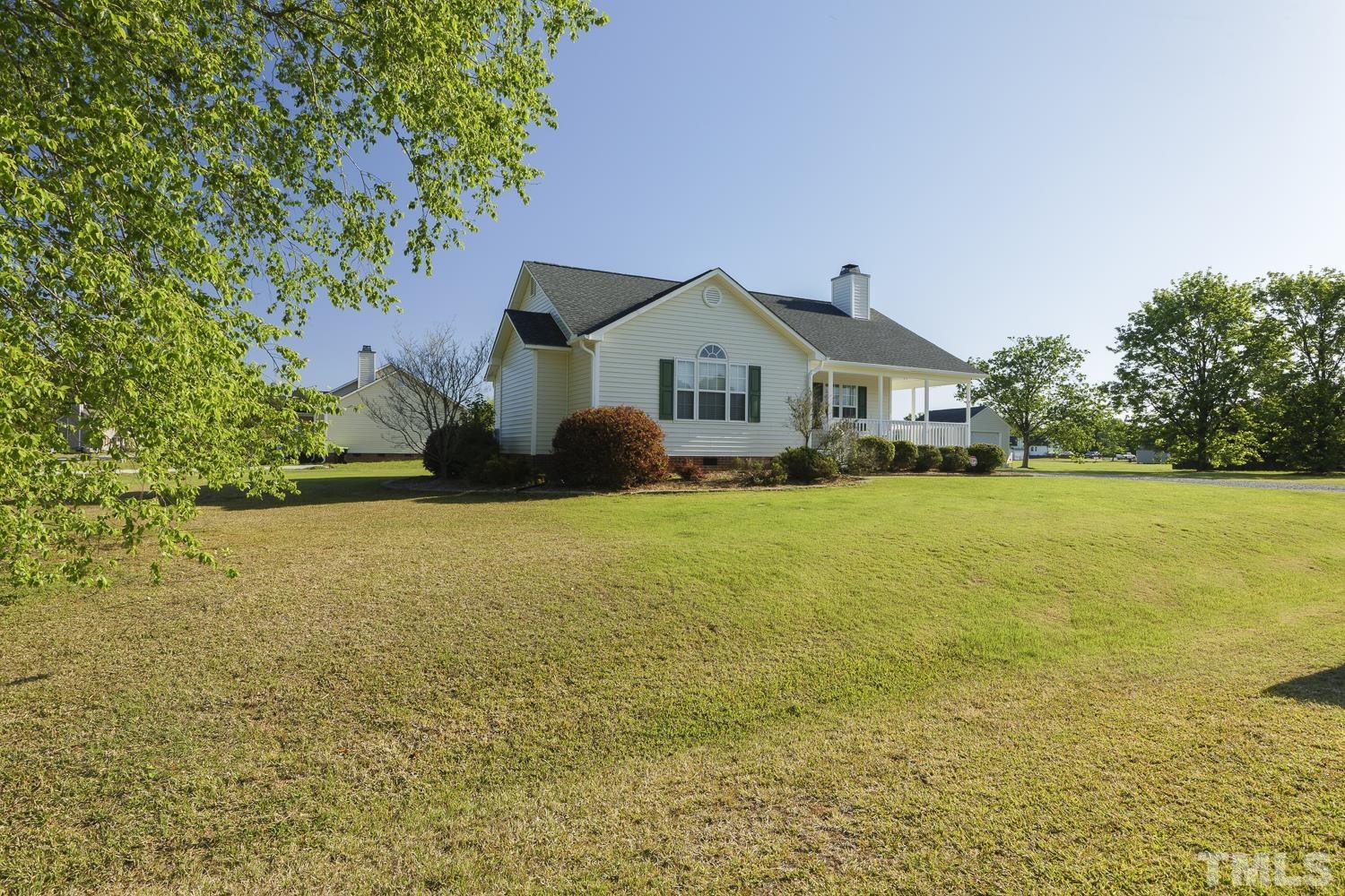 1001 Retriever Lane Raleigh, NC 27603 - Photo 5 of 50 a front view of a house with a yard