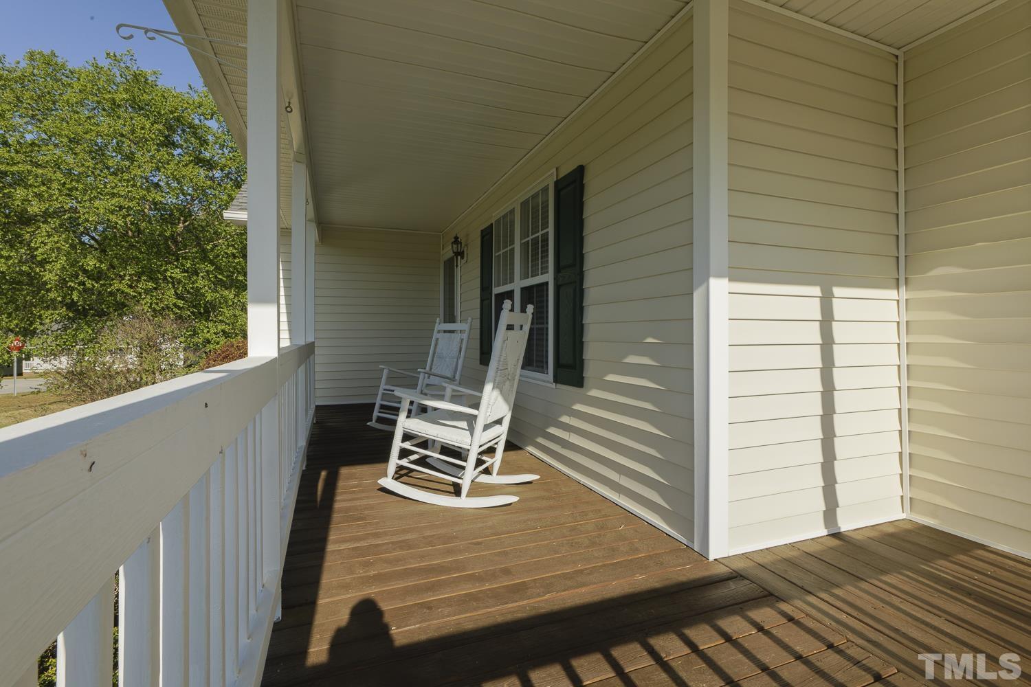 1001 Retriever Lane Raleigh, NC 27603 - Photo 7 of 50 a view of deck with wooden floor and outdoor seating