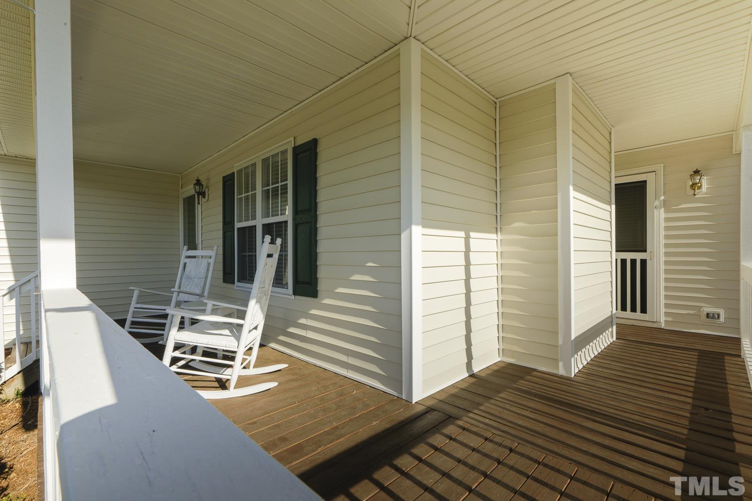 1001 Retriever Lane Raleigh, NC 27603 - Photo 8 of 50 a balcony with table and chairs