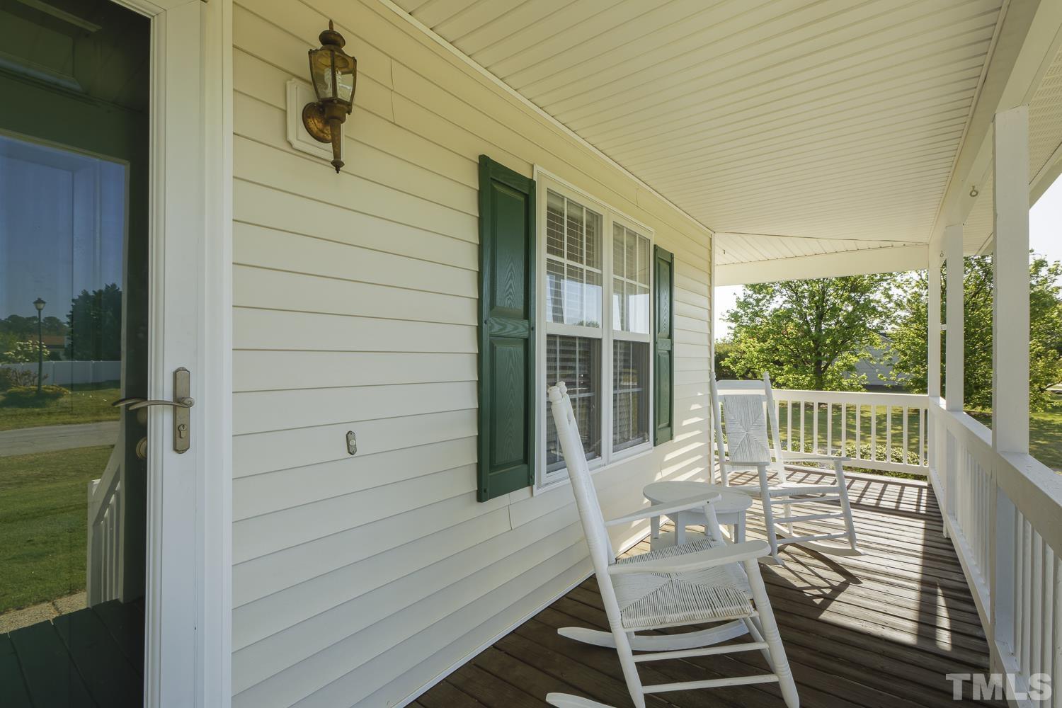 1001 Retriever Lane Raleigh, NC 27603 - Photo 9 of 50 a view of a balcony with a table and chairs
