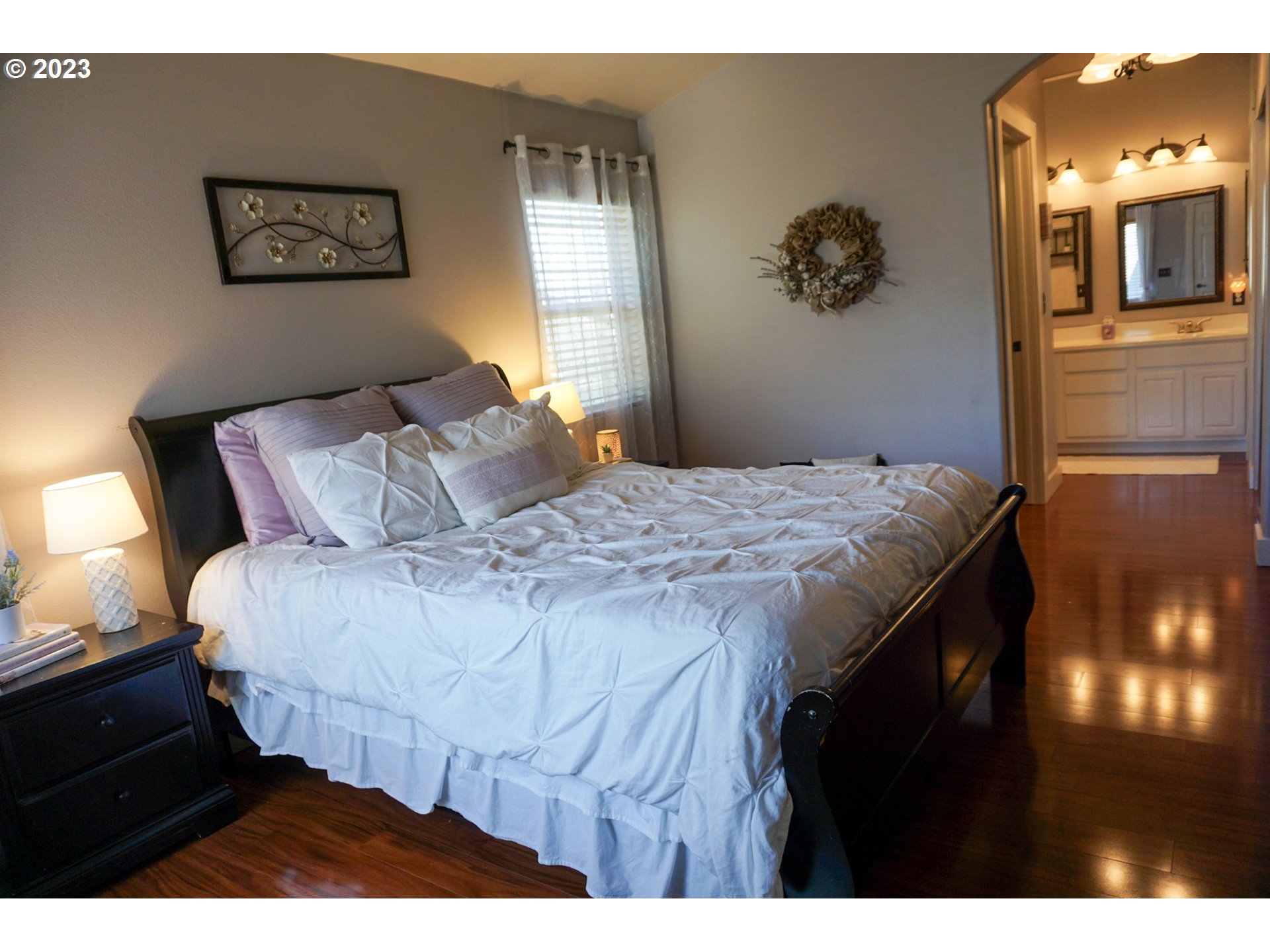 1864 Heitzman Way Eugene, OR 97402 - Photo 13 of 26 a bedroom with a bed and a chandelier