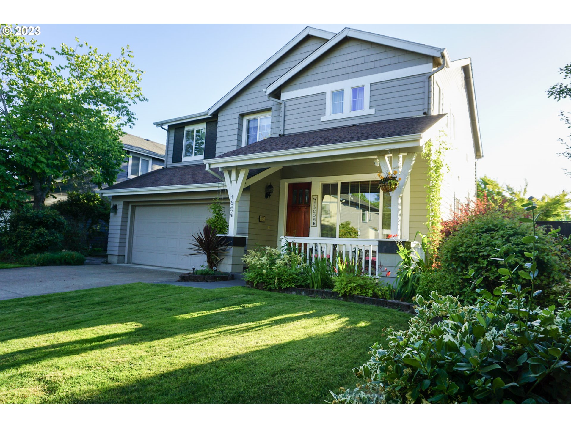 1864 Heitzman Way Eugene, OR 97402 - Photo 2 of 26 a view of a house with a yard and sitting area