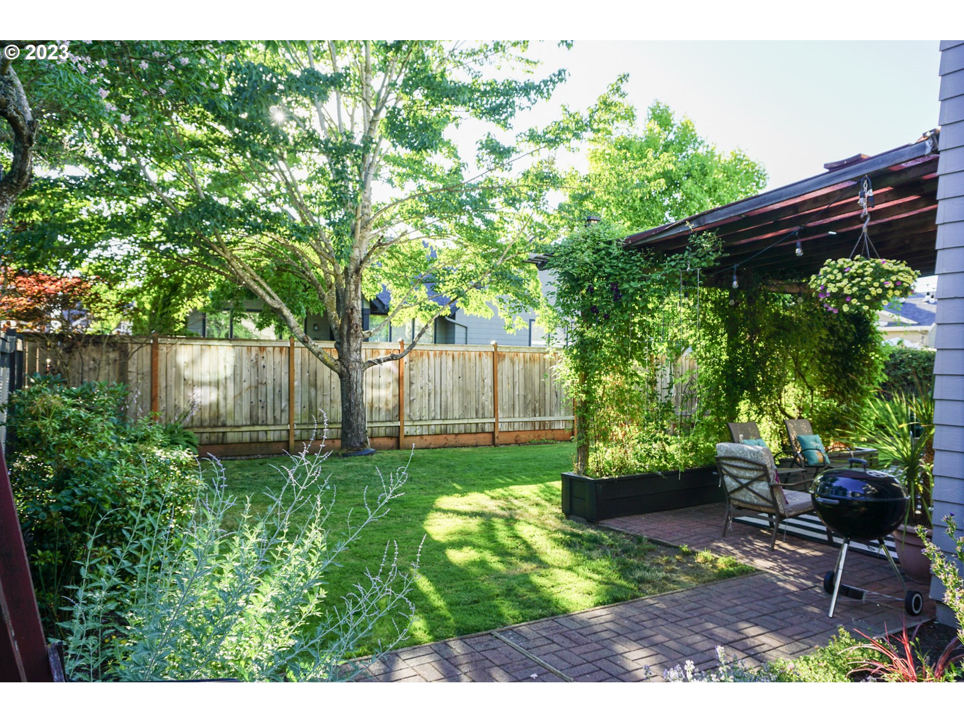 1864 Heitzman Way Eugene, OR 97402 - Photo 25 of 26 a view of a backyard with plants and a garden