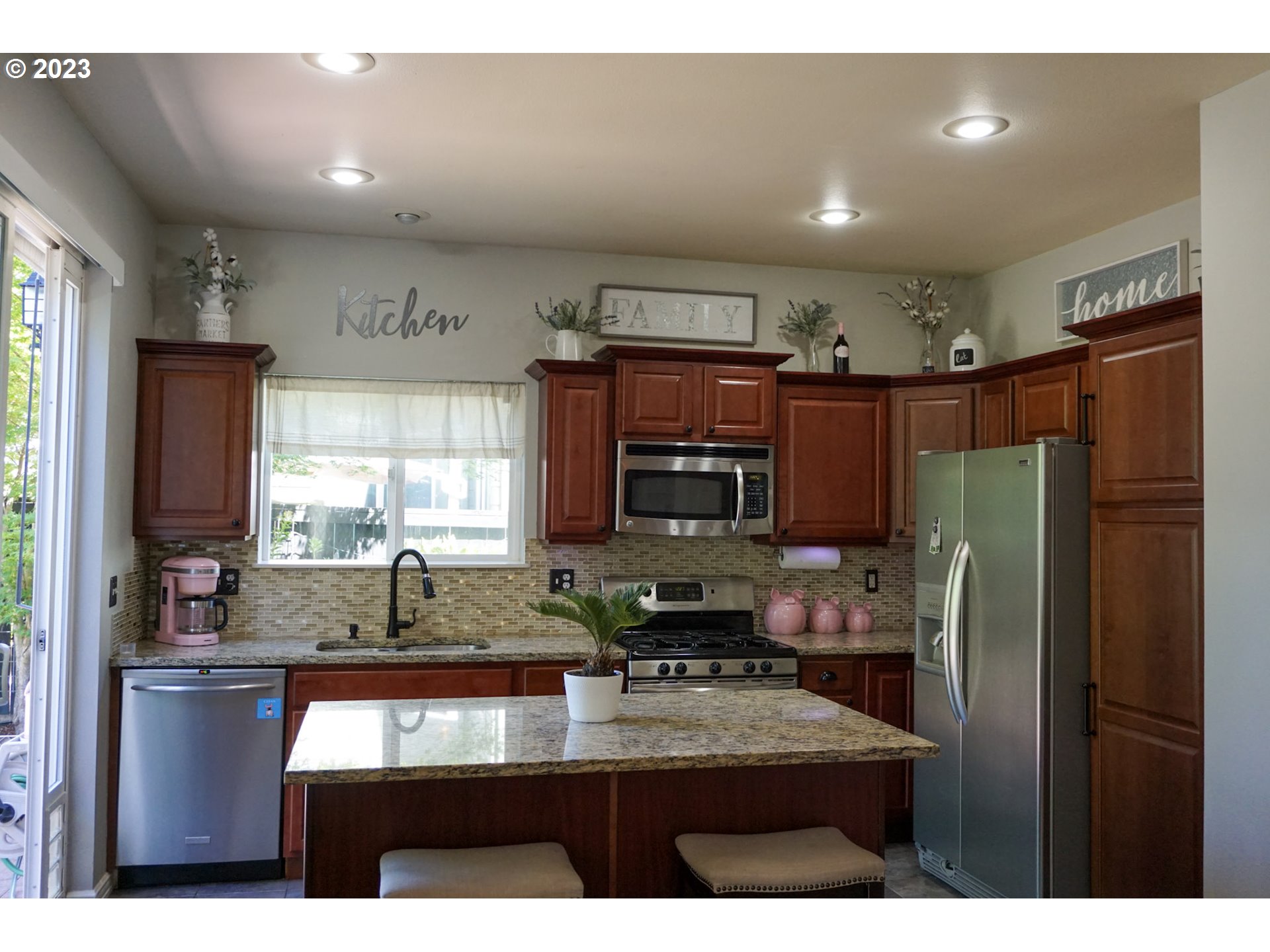 1864 Heitzman Way Eugene, OR 97402 - Photo 8 of 26 a kitchen with refrigerator and cabinets