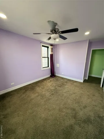 a room with a bed and a chandelier