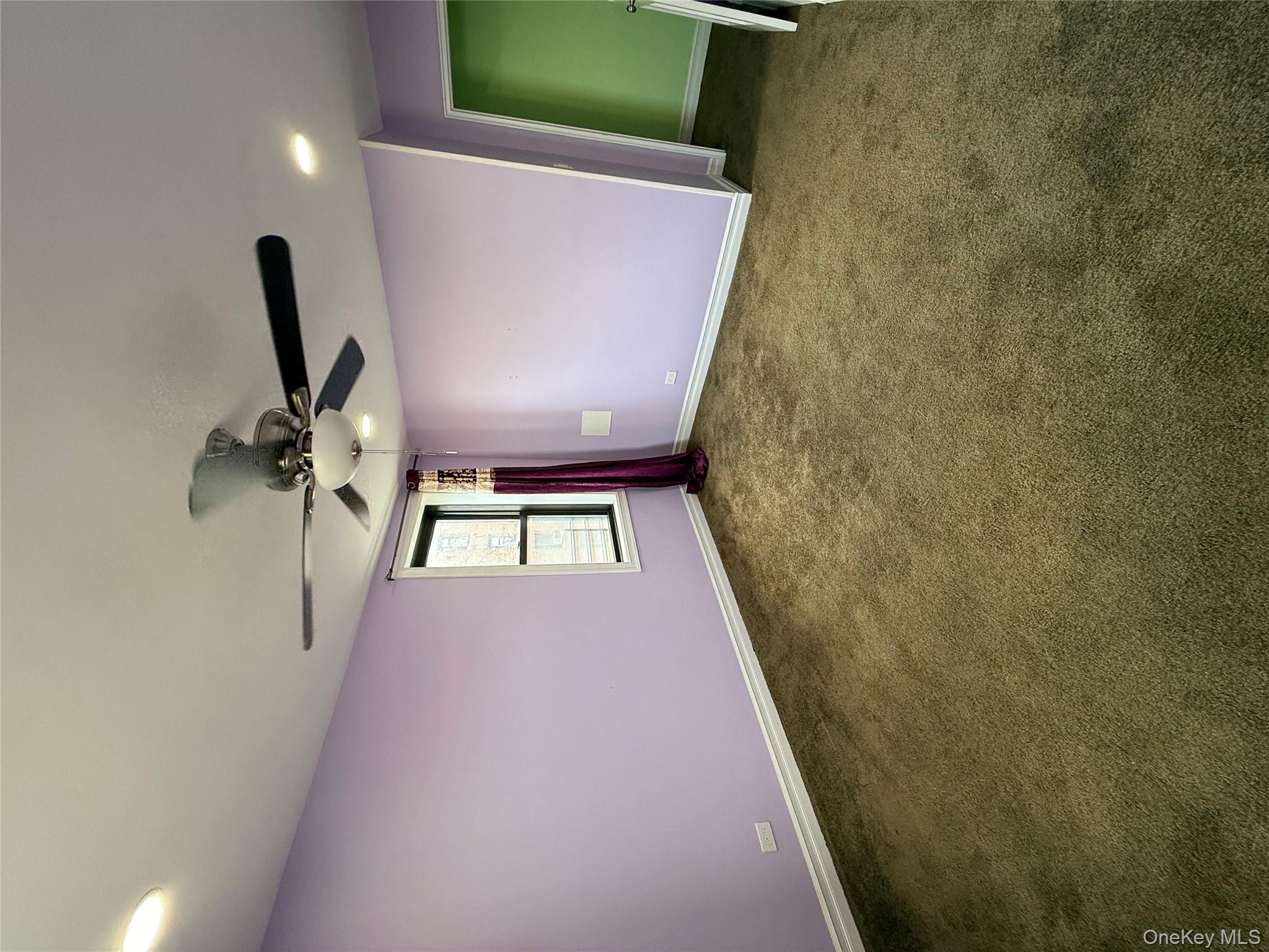 112-30 Northern Boulevard, Unit 4G Queens, NY 11368 - Photo 12 of 18 en empty room with windows