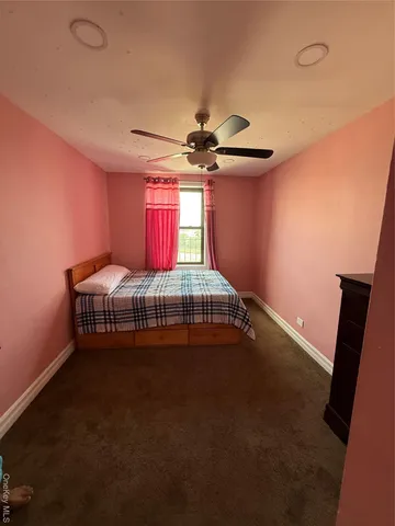 a view of a room with furniture and windows
