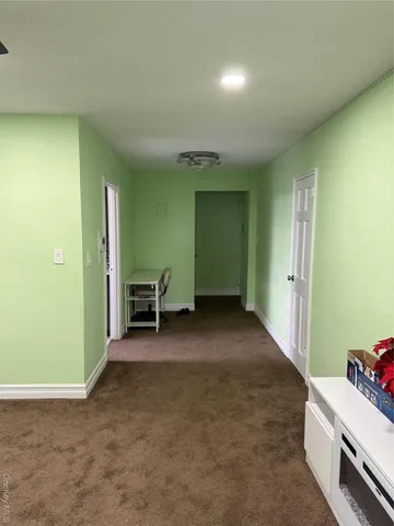 en empty room with a fan