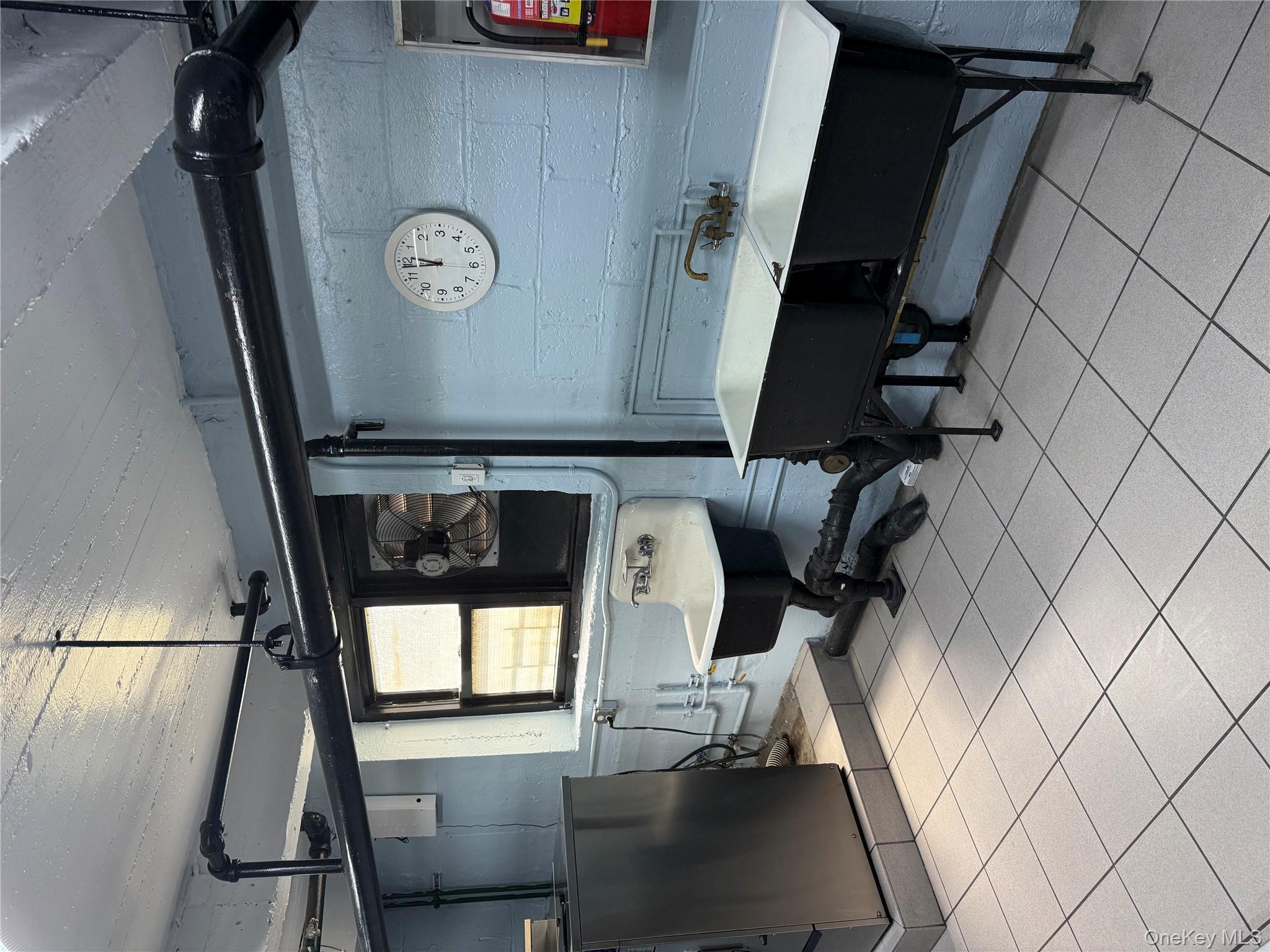 112-30 Northern Boulevard, Unit 4G Queens, NY 11368 - Photo 17 of 18 a living room with a couch and a table