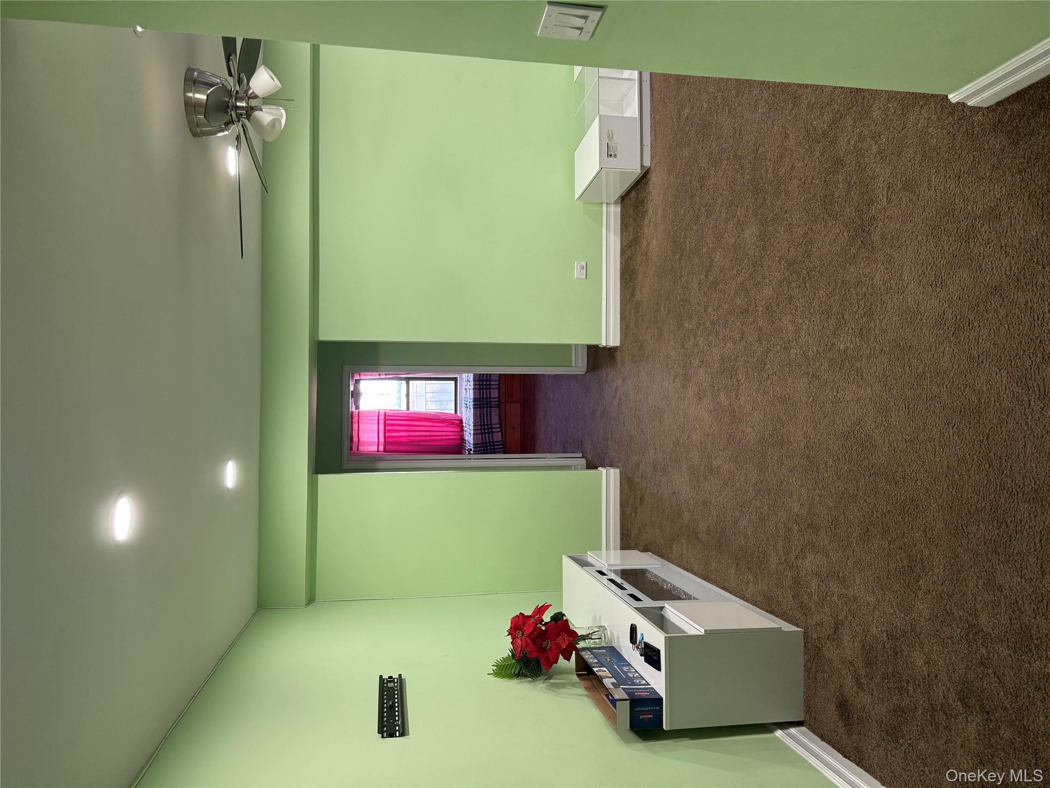 112-30 Northern Boulevard, Unit 4G Queens, NY 11368 - Photo 4 of 18 a room with furniture and a window