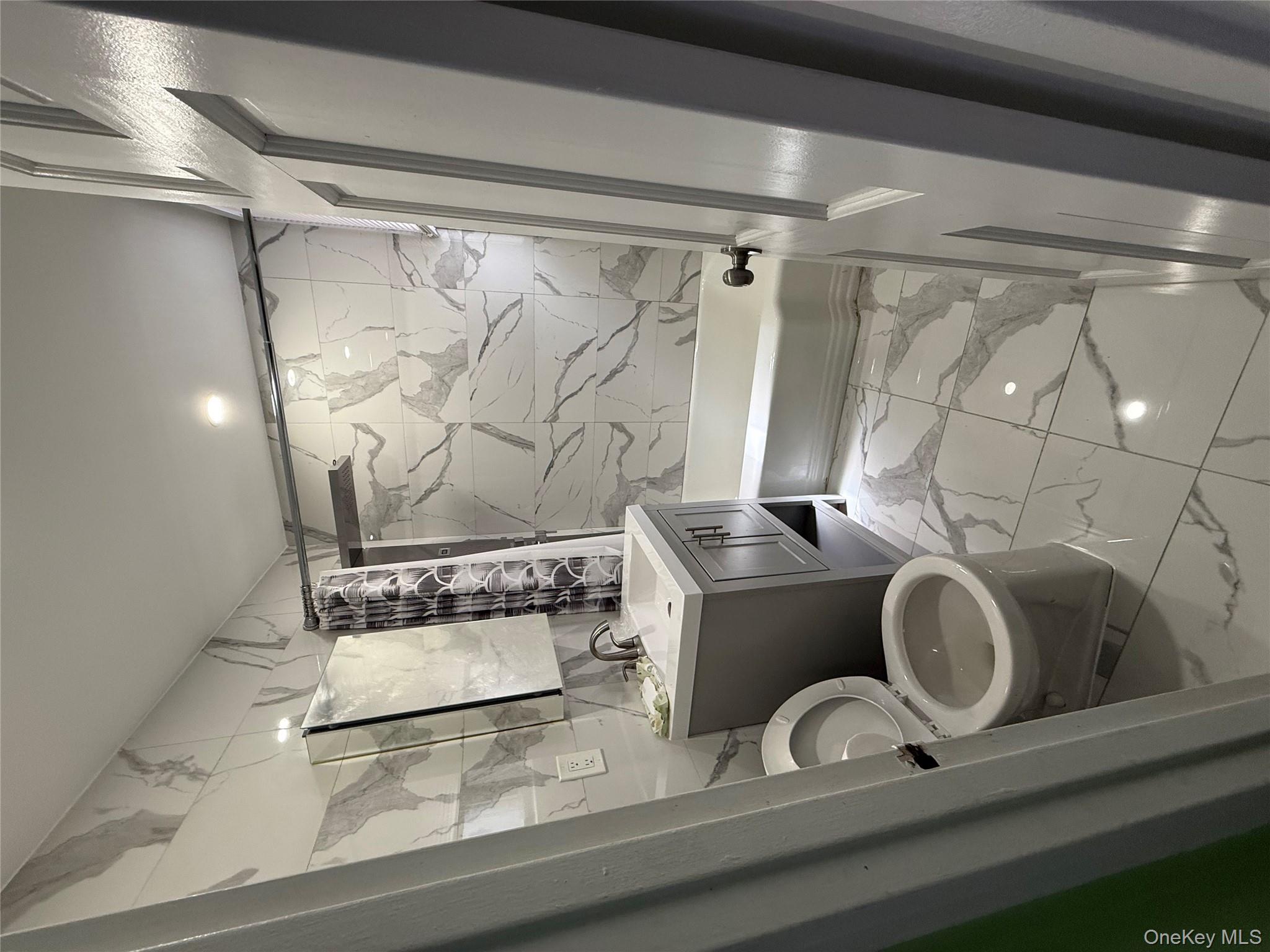 112-30 Northern Boulevard, Unit 4G Queens, NY 11368 - Photo 10 of 18 a bathroom with a toilet sink and shower