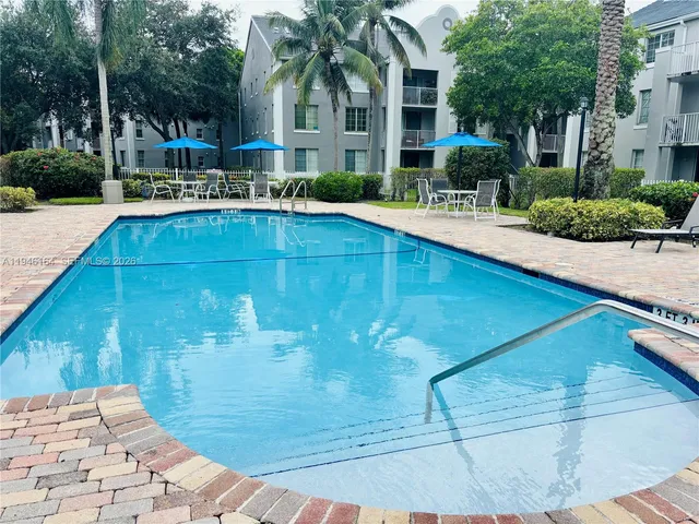 a view of a swimming pool with a patio