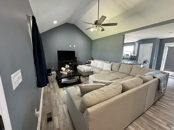 a view of hallway with wooden floor