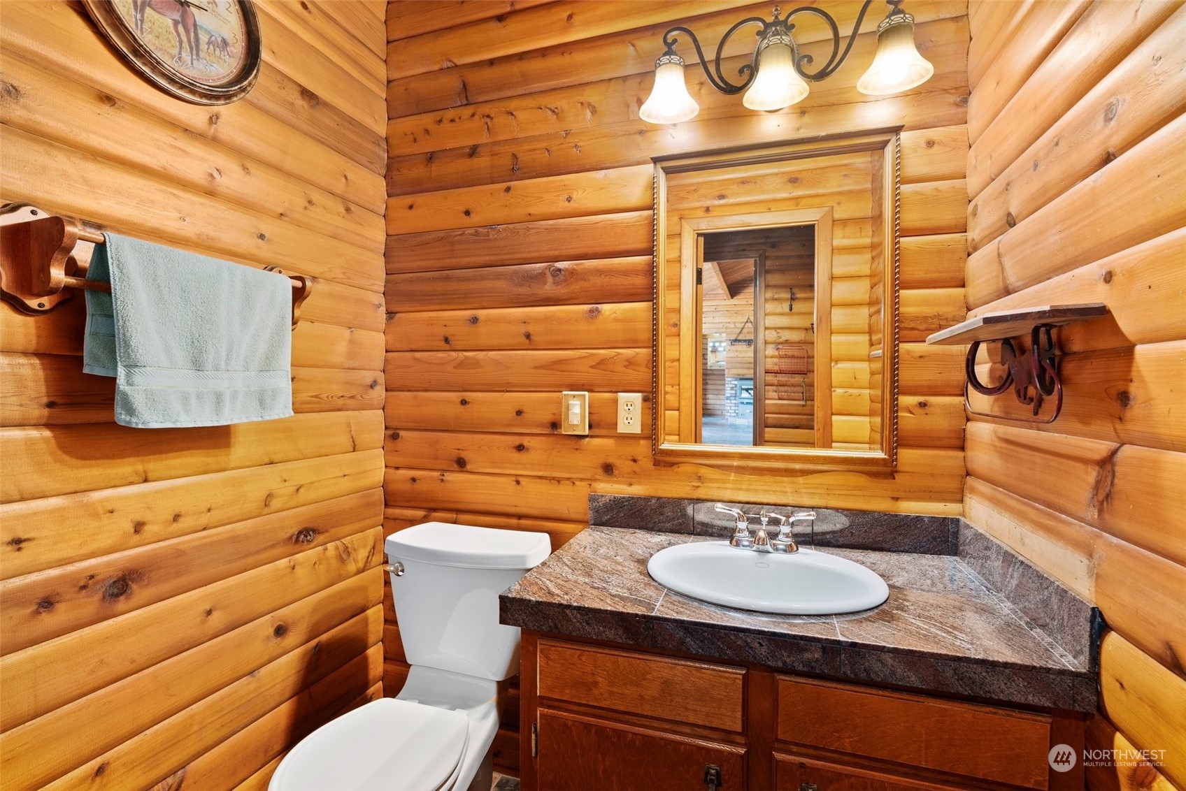 1028 King Road Winlock, WA 98596 - Photo 21 of 38 a bathroom with a granite countertop sink and a mirror