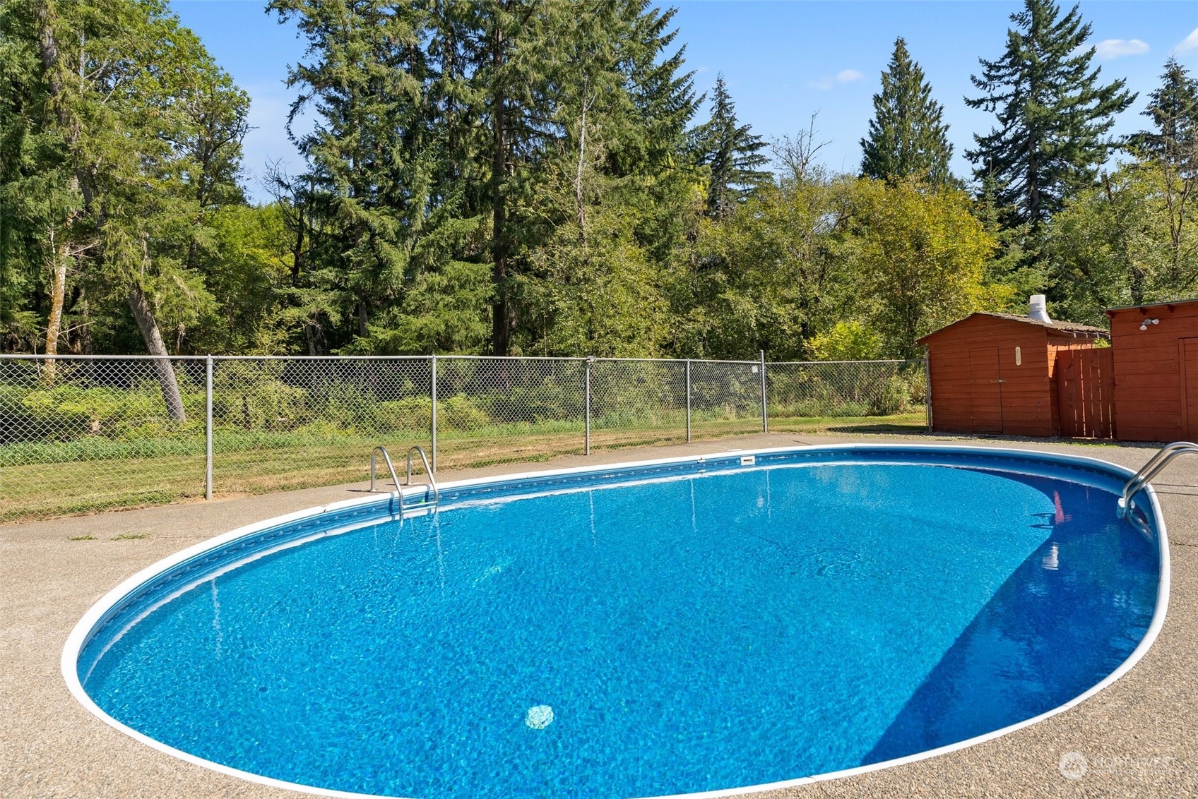 1028 King Road Winlock, WA 98596 - Photo 30 of 38 a view of a swimming pool with an outdoor space and seating area