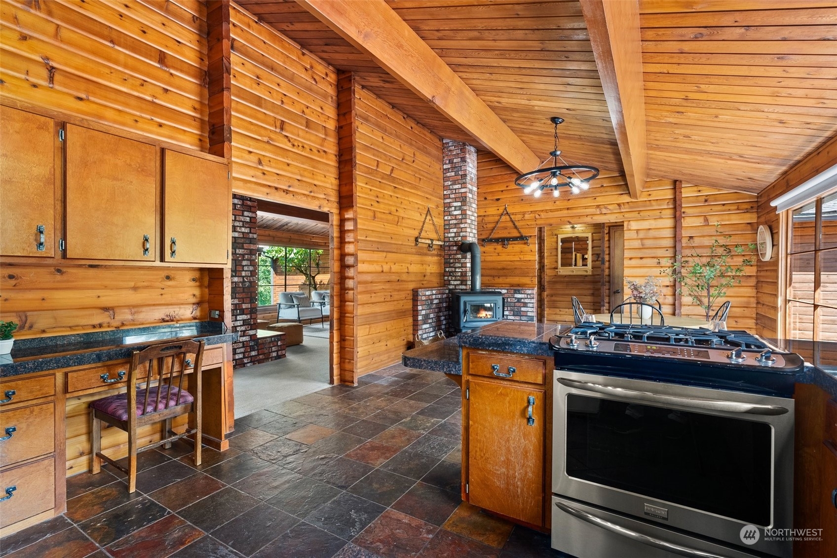 1028 King Road Winlock, WA 98596 - Photo 4 of 38 a view of a kitchen with a stove and a chair