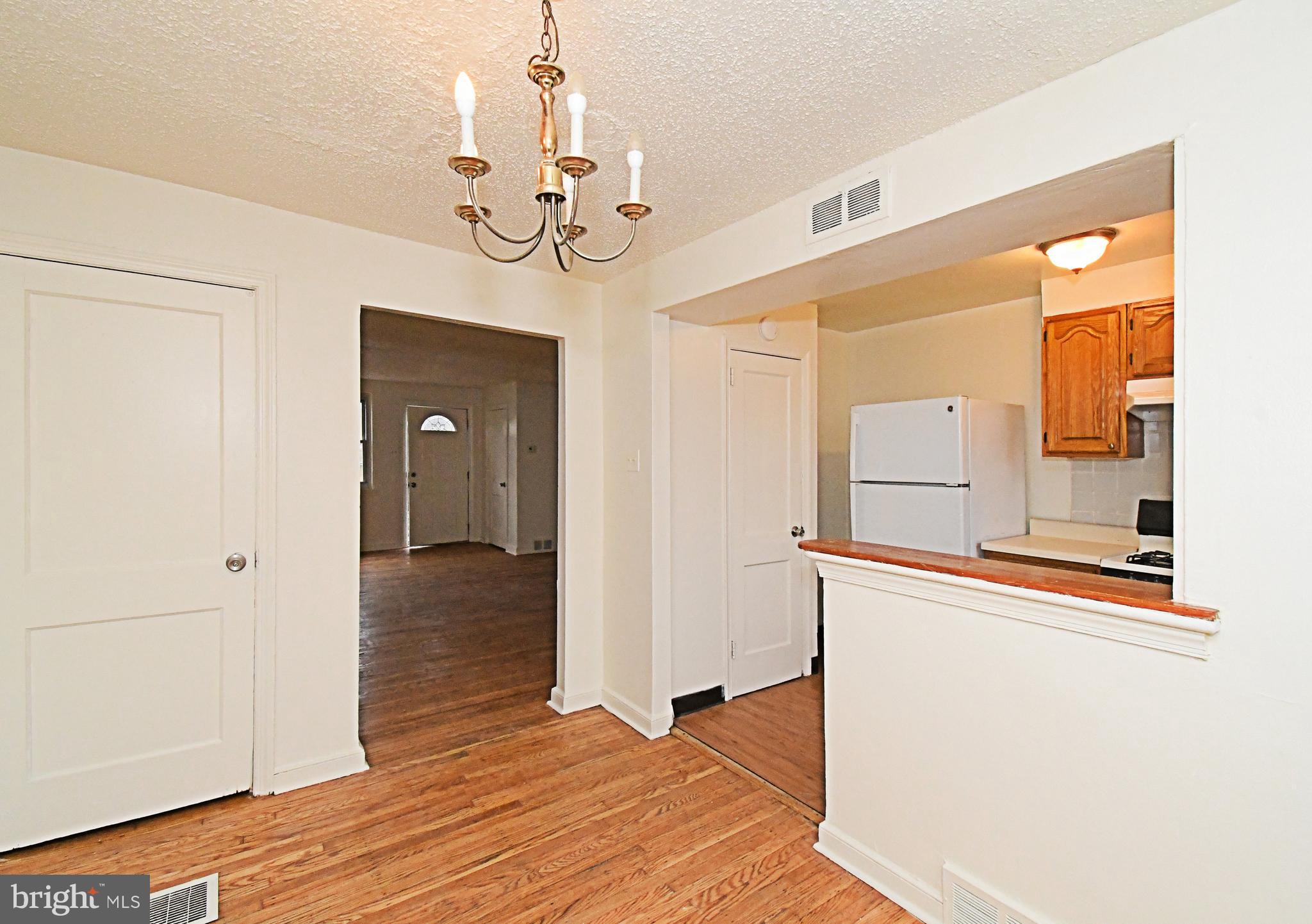 1107 East Sharpnack Street Philadelphia, PA 19150 - Photo 15 of 41 a view of a hallway with wooden floor and chandelier