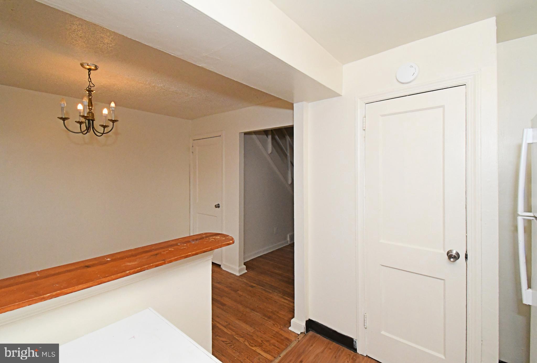 1107 East Sharpnack Street Philadelphia, PA 19150 - Photo 16 of 41 a view of a hallway with wooden floor and chandelier