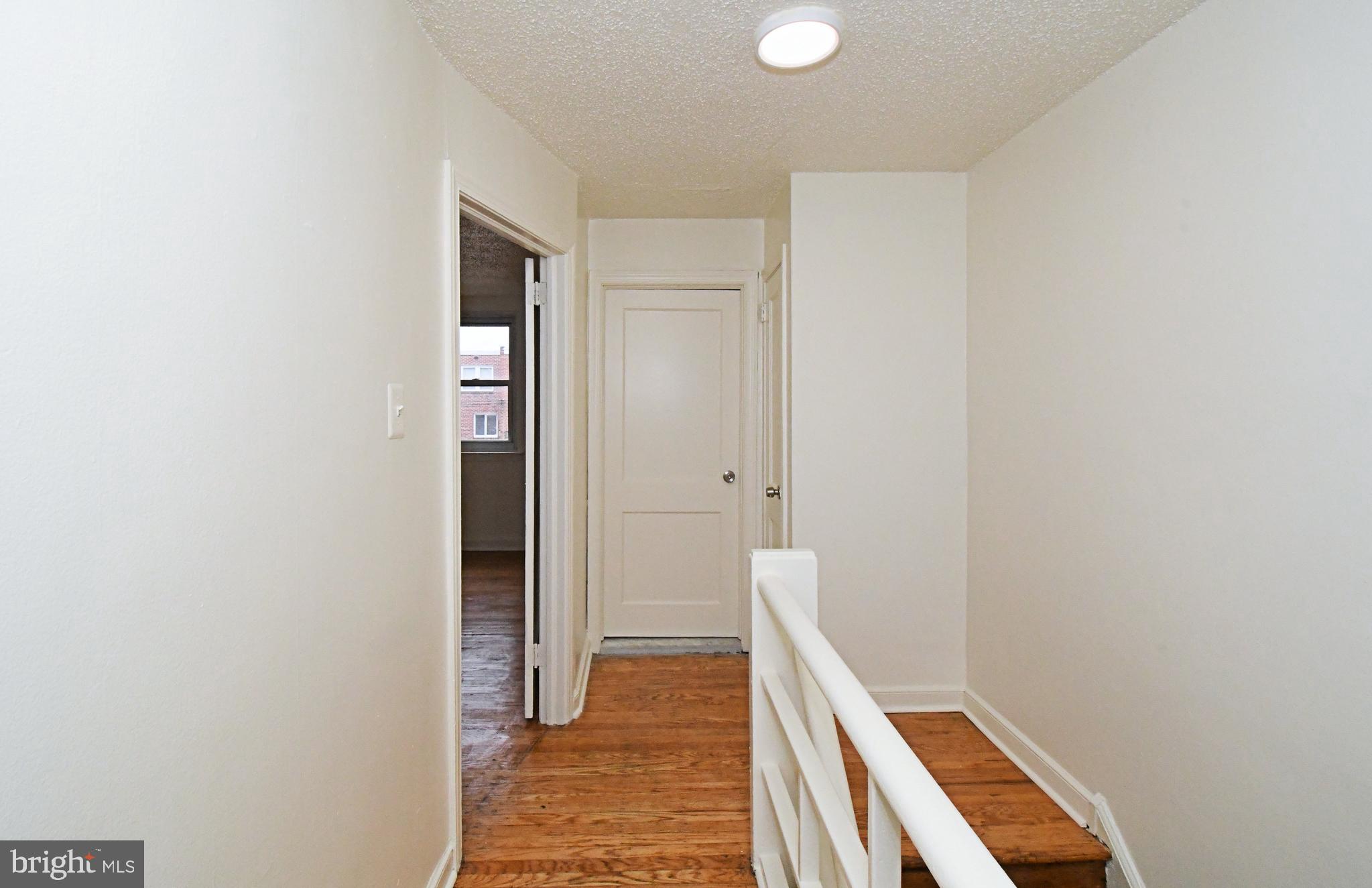 1107 East Sharpnack Street Philadelphia, PA 19150 - Photo 23 of 41 a view of hallway with wooden floor