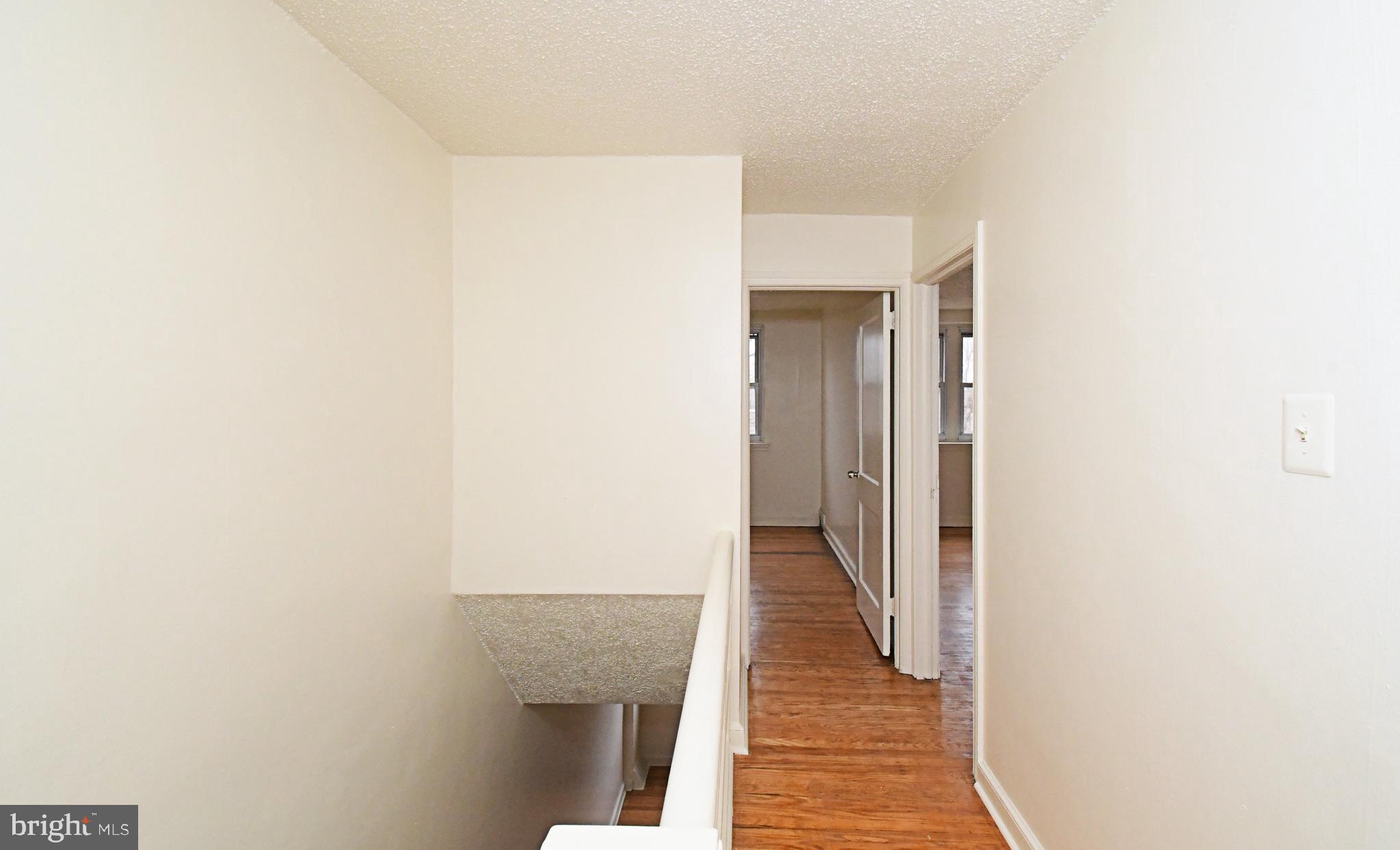 1107 East Sharpnack Street Philadelphia, PA 19150 - Photo 24 of 41 a view of a hallway with wooden floor