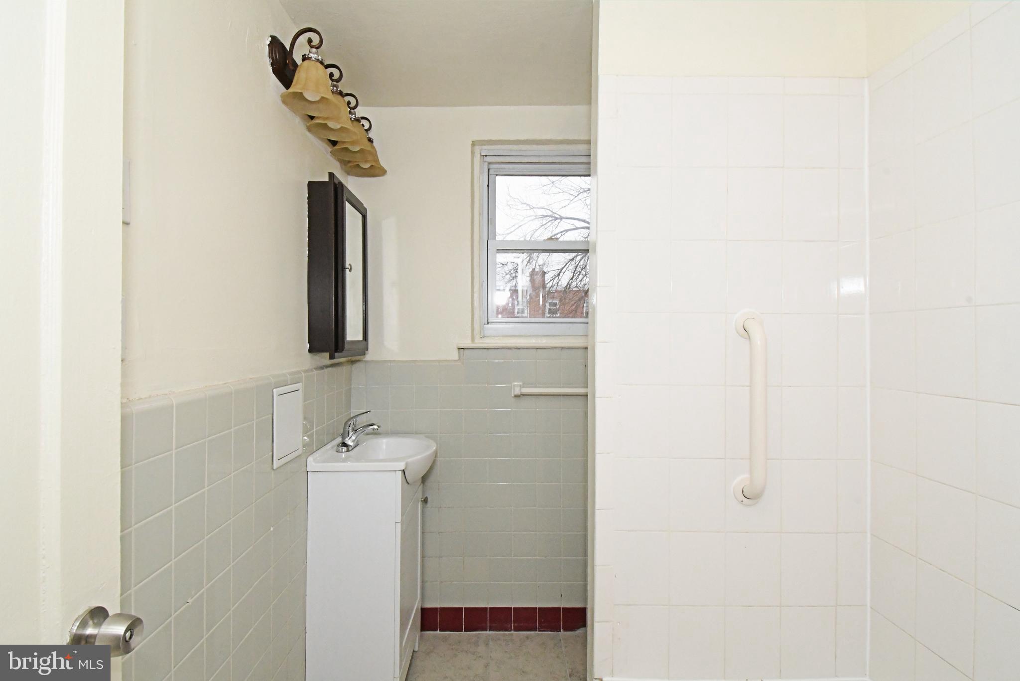1107 East Sharpnack Street Philadelphia, PA 19150 - Photo 26 of 41 a bathroom with a shower